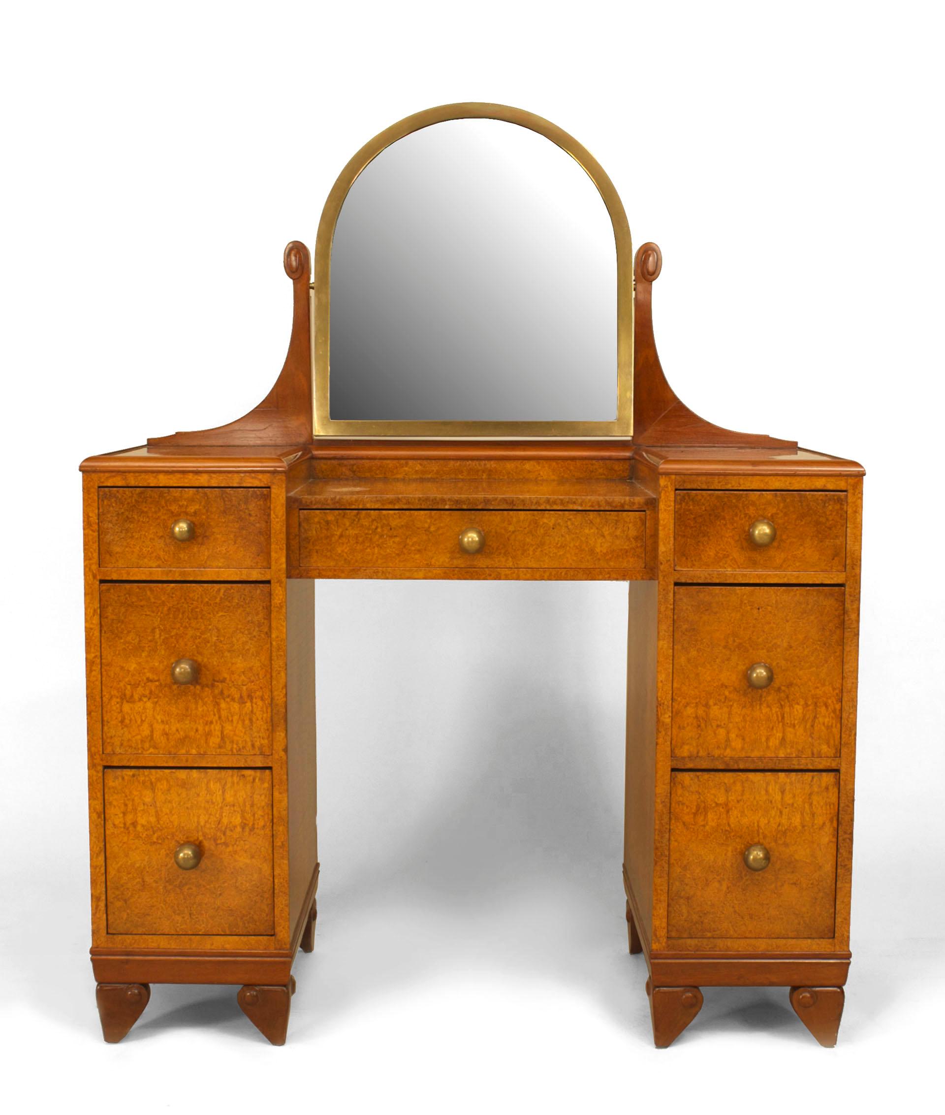 French Art Deco amboyna wood kneehole dressing table with a vanity mirror framed in bronze and seven drawers with brass ball-shaped pulls.