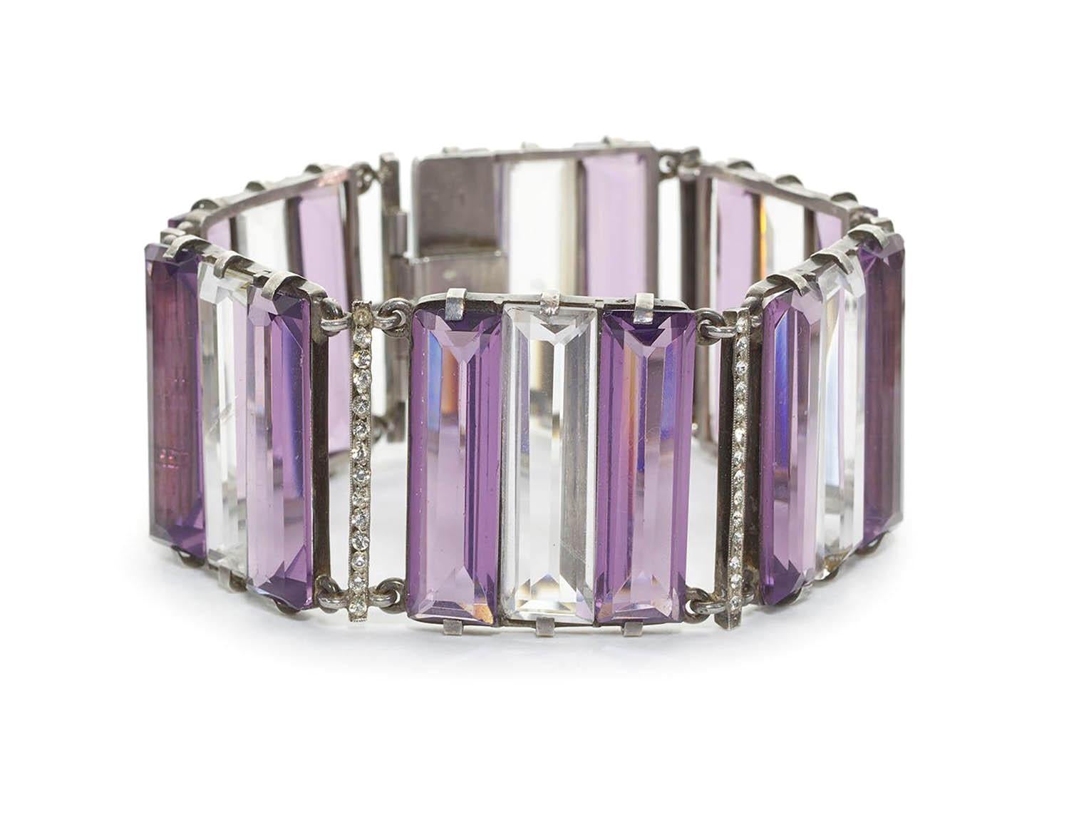 A French Art Deco amethyst, rock crystal and eight-cut paste bracelet, with three stone groups of two large baguette-cut amethysts with rock crystal in the middle, with paste set spacers between, mounted in silver, with French boar marks for silver,