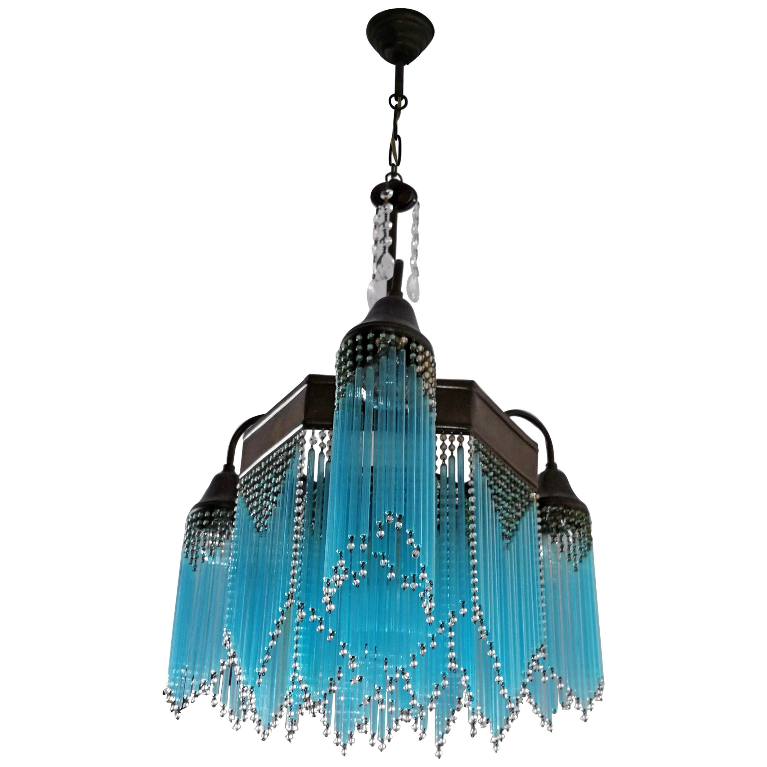 Gorgeous antique French chandelier in turquoise blue beaded glass tubes, Art Deco / Art Nouveau.
Measures:
Diameter 21 in / 53 cm
Height 34.6 in / 88 cm
4-light bulbs E27/ good working condition/European wiring.
Your item will be carefully
