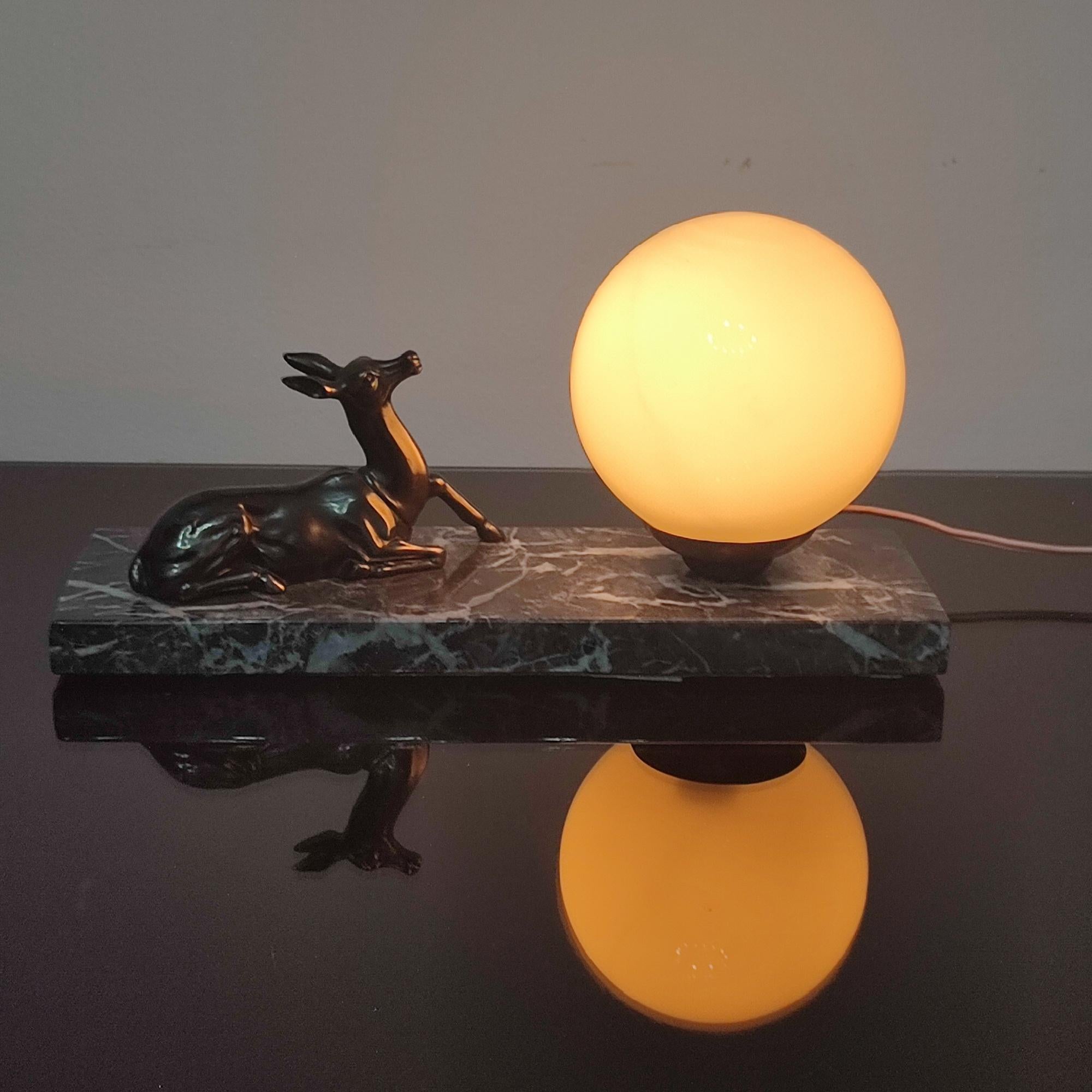 French Art Deco antelope table lamp or night-light sculpture, 1930s. Made of spelter, marble and glass. Old silvered spelter antelope. Opal glass shade. Marble base. Bayonet bulb base. original wiring. 
In very good original condition.
Dimensions:
