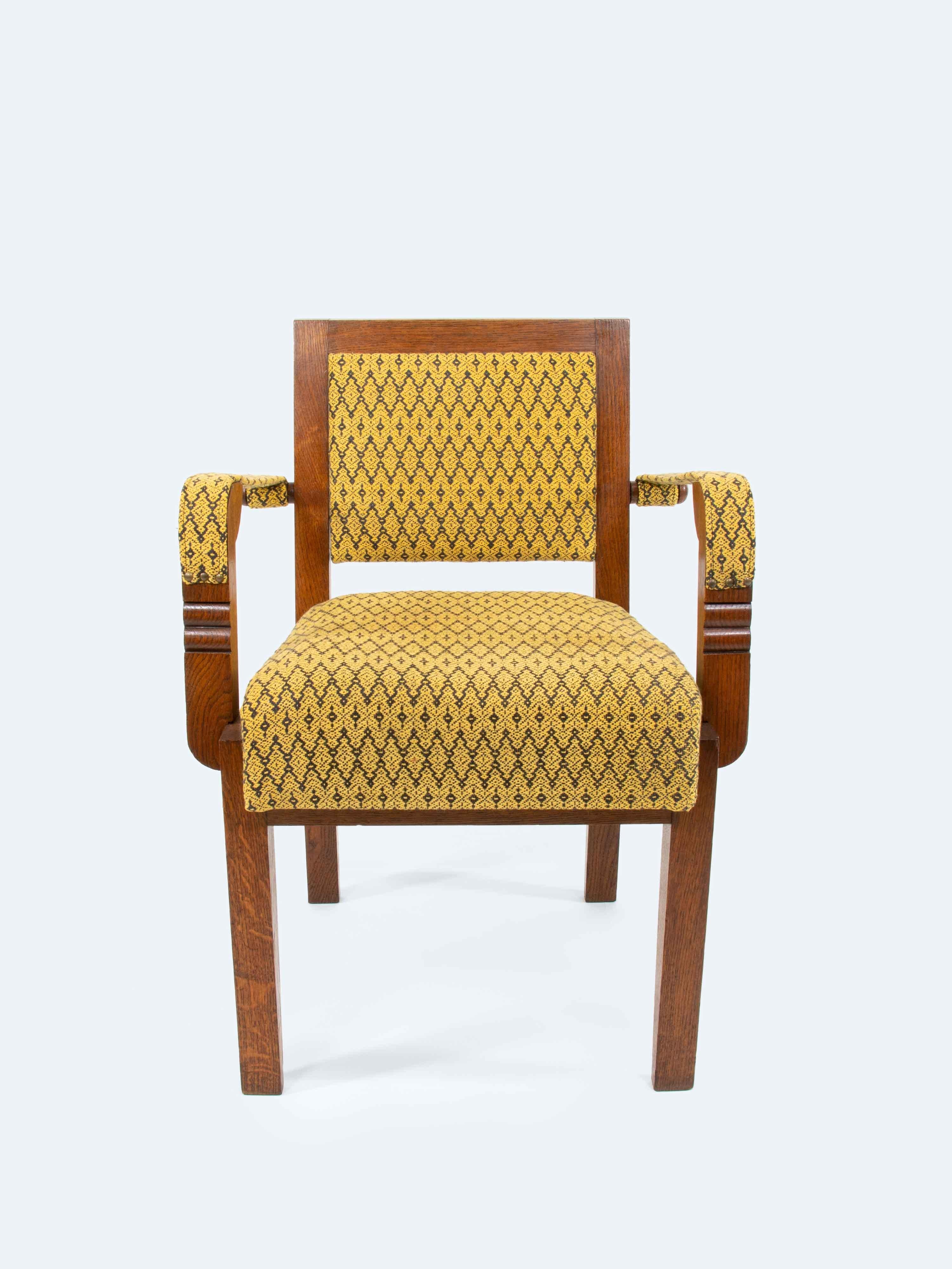 This striking armchair by Charles Dudouyt, a key figure in French Art Deco, exemplifies the sophistication and elegance that define the era. Crafted from solid oak wood, stained and lacquered to perfection, the chair features a unique inset seat