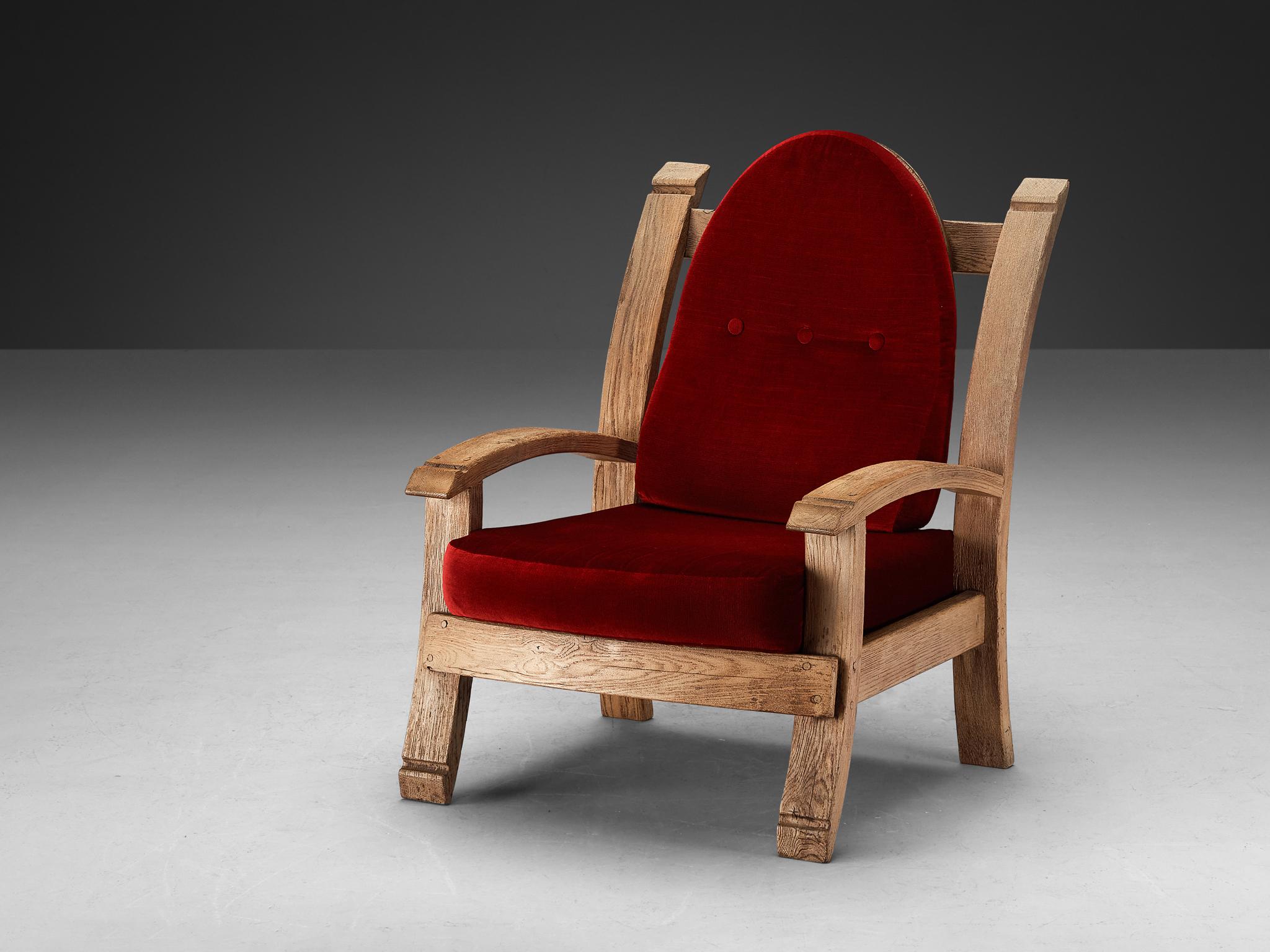 Lounge chair, oak, velvet, France, 1940s

Charming French Art Deco armchair made in oak. The design features bulky forms with with features that remind of a throne, such as the high, almost majestic backrests that slightly leans backwards. The arms