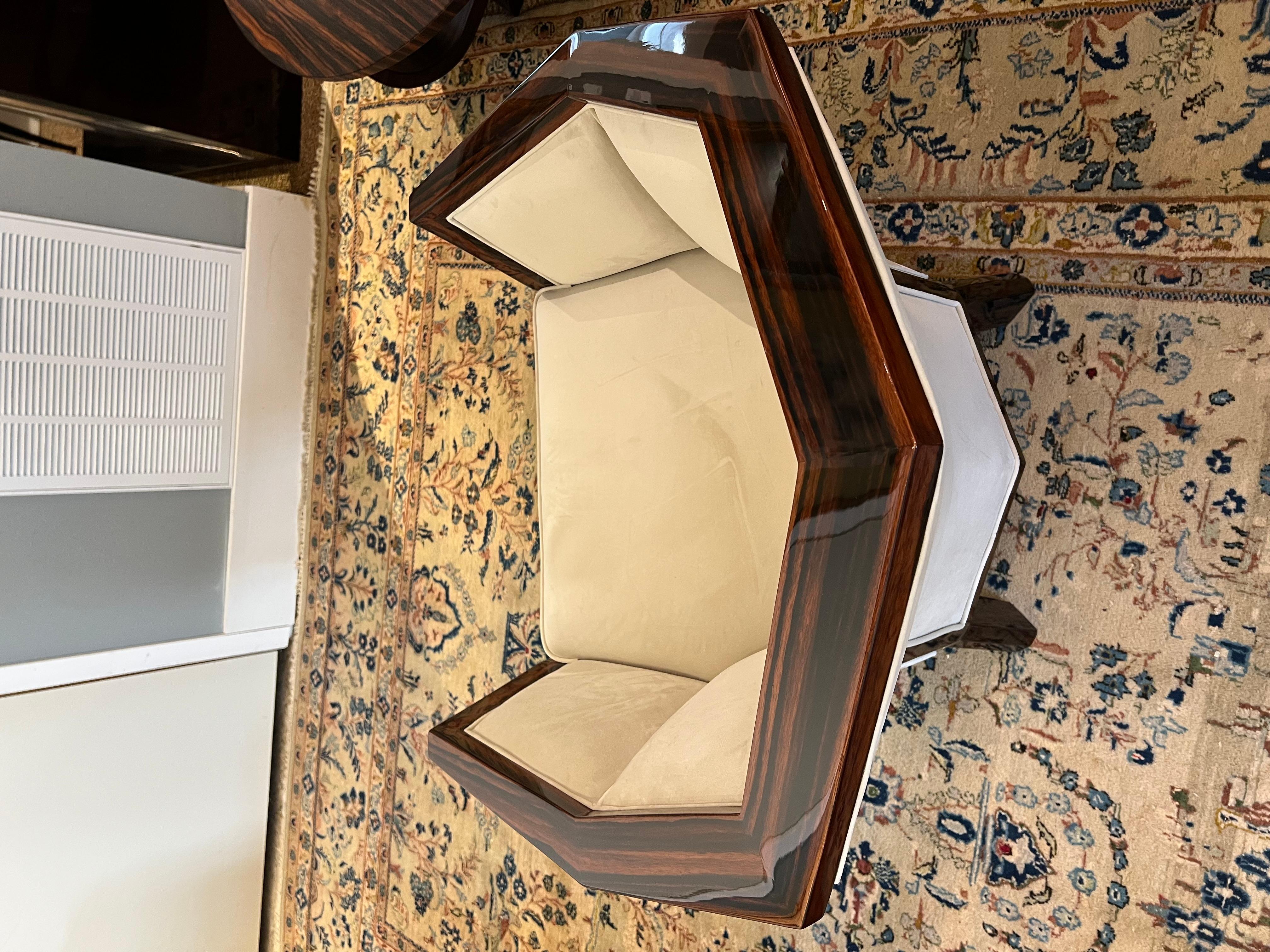  The armchair is made out of walnut wood, newly re-upholstered with light velvety fabric. The chair has a firm back and rests on 4 rectangular legs.

        France, c. 1930s
         31” x 31” x 31”, seat height is 17