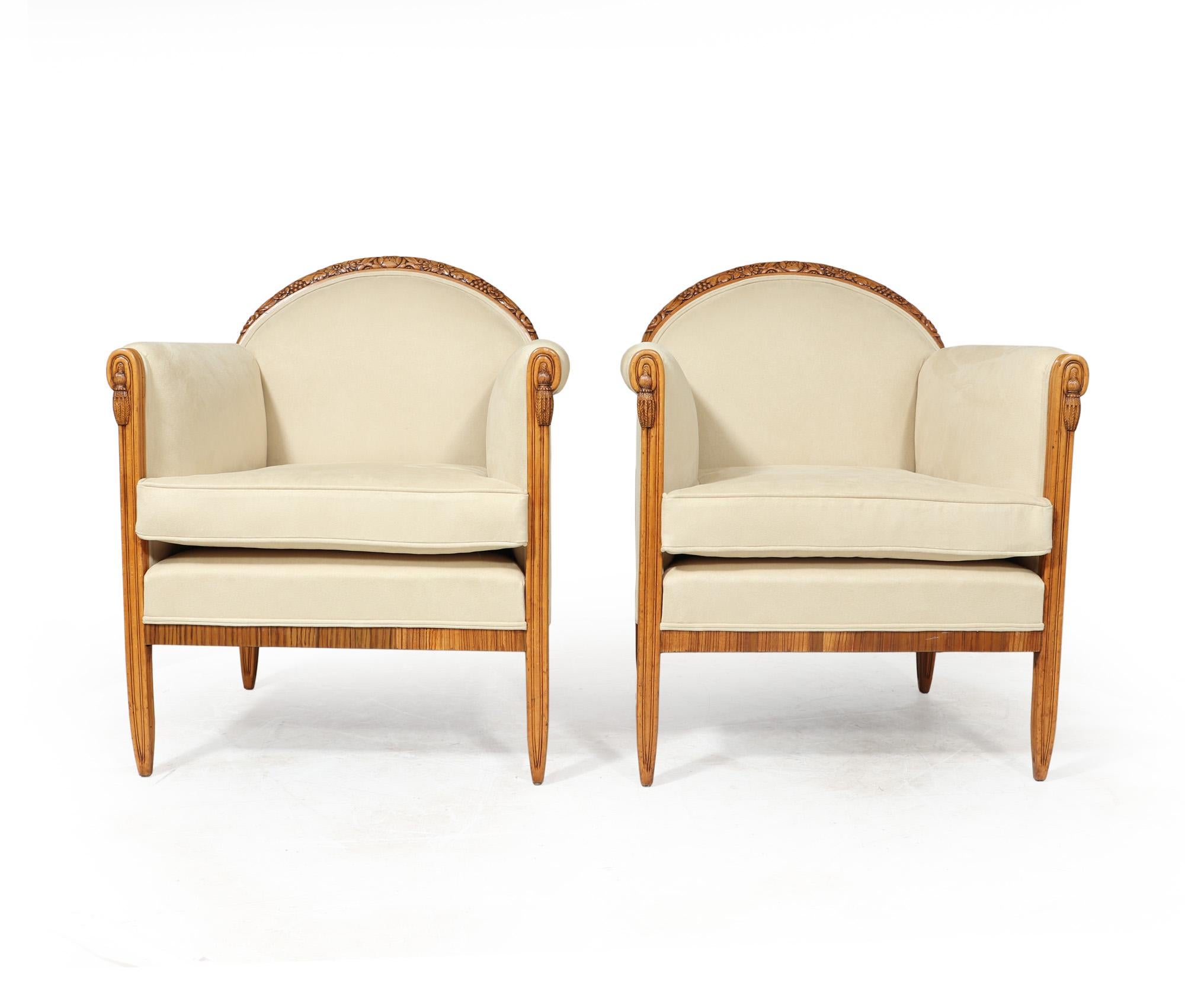 ARMCHAIRS BY PAUL FOLLOT
A Pair of armchairs in beech with zebrano detail, crisply carved with a very classic French Art Deco form, designed and produced by one of the Masters of the Art Deco period, Paul Follot having a floral curved top edge and