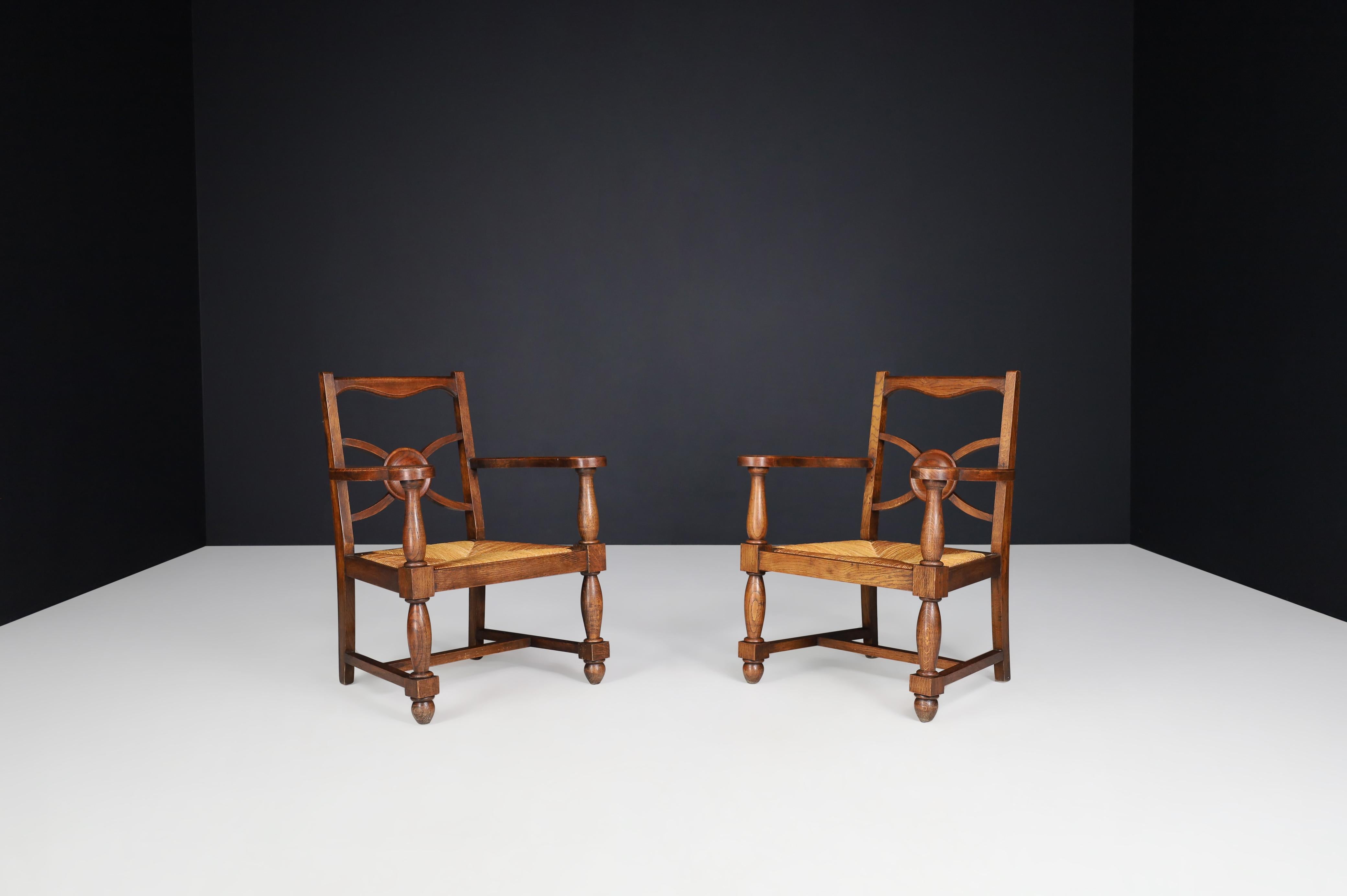Art Deco Armchairs in oak and rush, France 1930s.

These gorgeous art-deco armchairs were crafted in France, circa 1930. Fantastic good original condition with a lovely patina. These chairs would be an eye-catching addition to any interior, such