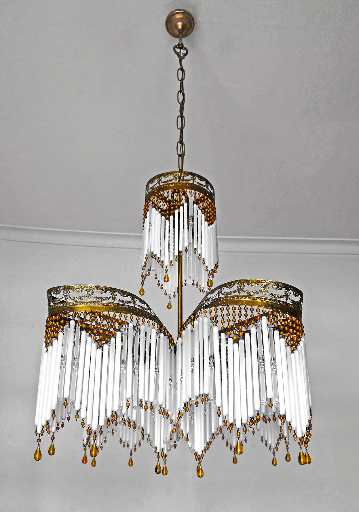 Gorgeous antique French chandelier in beaded opaline glass tubes, Art Deco / Art Nouveau, circa 1920.
Dimensions:
Height 49.22 in. (chain 17.71 in.)/ 125 cm (chain 45cm)
Diameter 20.48 in. (52 cm)
6-light bulbs E14/ good working condition.
Age