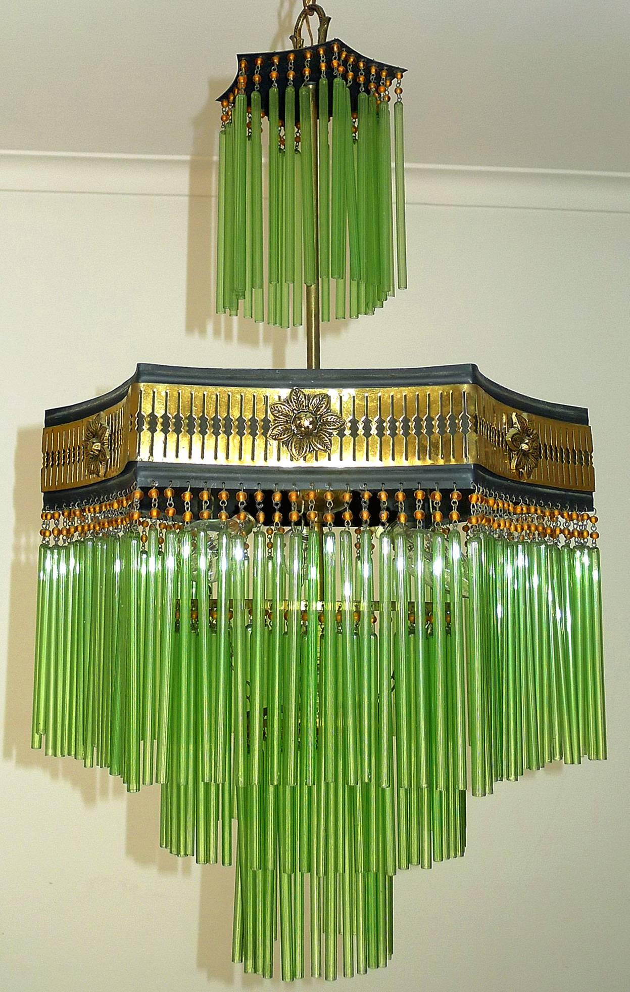 Fabulous French Art Deco & Art Nouveau gilt chandelier with amber glass beads and green glass straws
Measures: Diameter 16 in/ 40 cm
Height: 44 in (32 in + 12 in chain)/ 110 cm (80 cm + 30 cm chain)
Weight: 5 lb/ 4 Kg
Four light bulbs E14/ Good