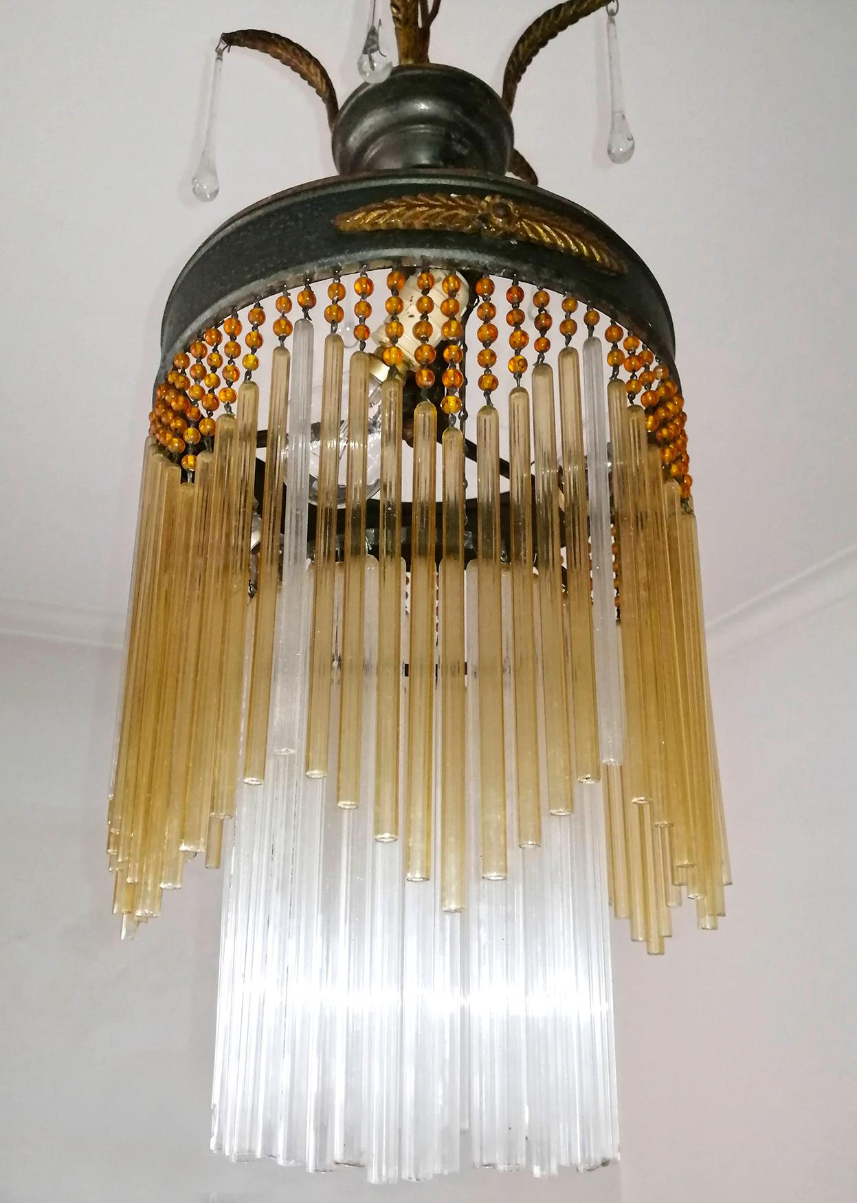 Antique French chandelier in amber beaded glass tubes, Art Deco / Art Nouveau.
Dimensions:
Height 36.23 in. (chain = 10 in.) /92 cm (chain = 25 cm)
Diameter 9.85 in. (25 cm)
3-light bulb E14/ good working condition
Assembly required. Bulbs not