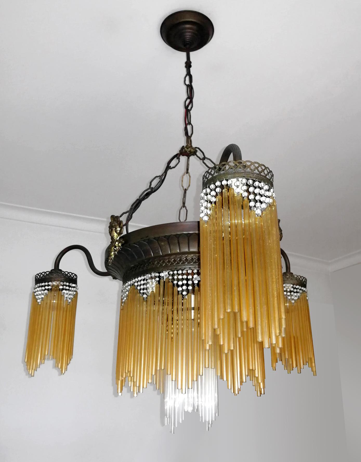 French Art Deco and Art Nouveau chandelier with glass beads and amber glass straws.
Measures:
Diameter: 28.34 in/ 72 cm
Height: 41.72 in (chain/ 9.84 in/chain)/ 106 cm (25 cm/chain)
Weight 12 lb/ 5 Kg
7-light bulbs E14/ + E27 good working