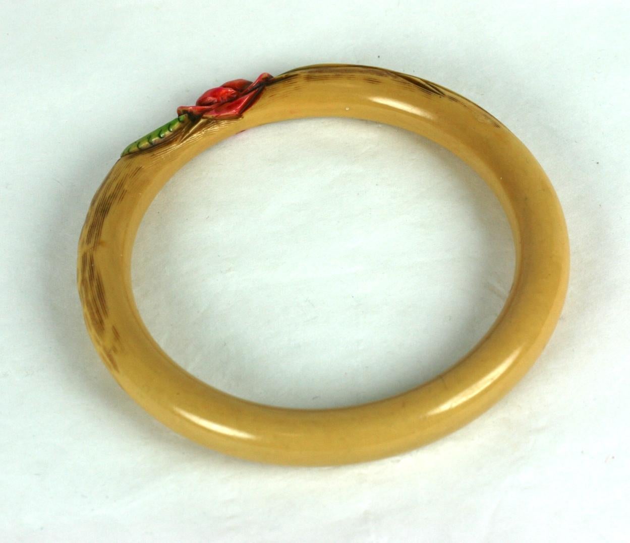 French Art deco carved bakelite rose bangle bracelet. The tubular cream color bracelet all hand carved with a sienna brown stain and cold painted with pink unfurling rose and green stained leaves
Excellent Condition. 1920's France.
Width