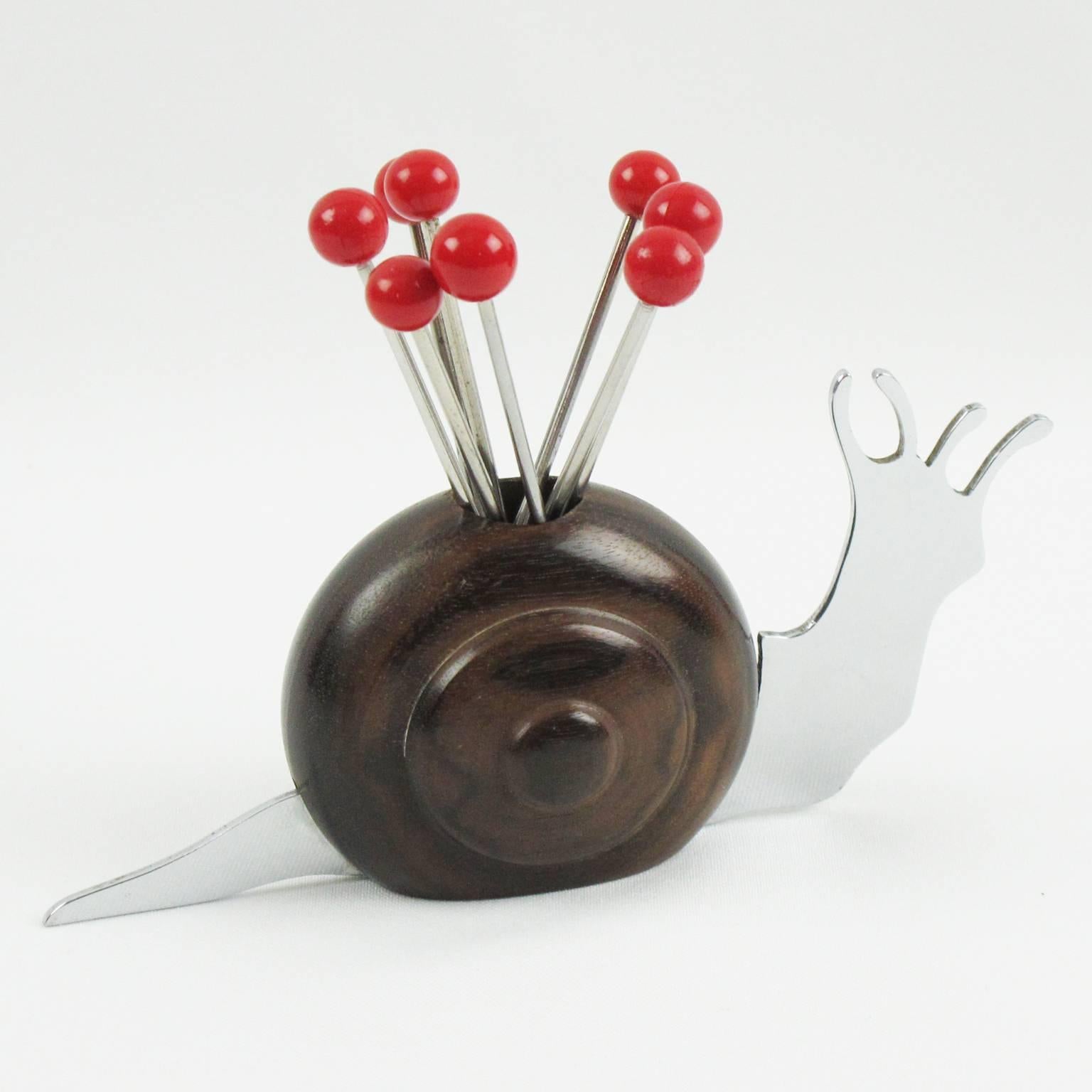 This wonderful French Art Deco barware bar set cocktail picks is made of wood and chromed metal. Features a lovely carved snail with Macassar wood shell and chromed metal body with eight metal cocktail forks with Galalith red bead finial. This set