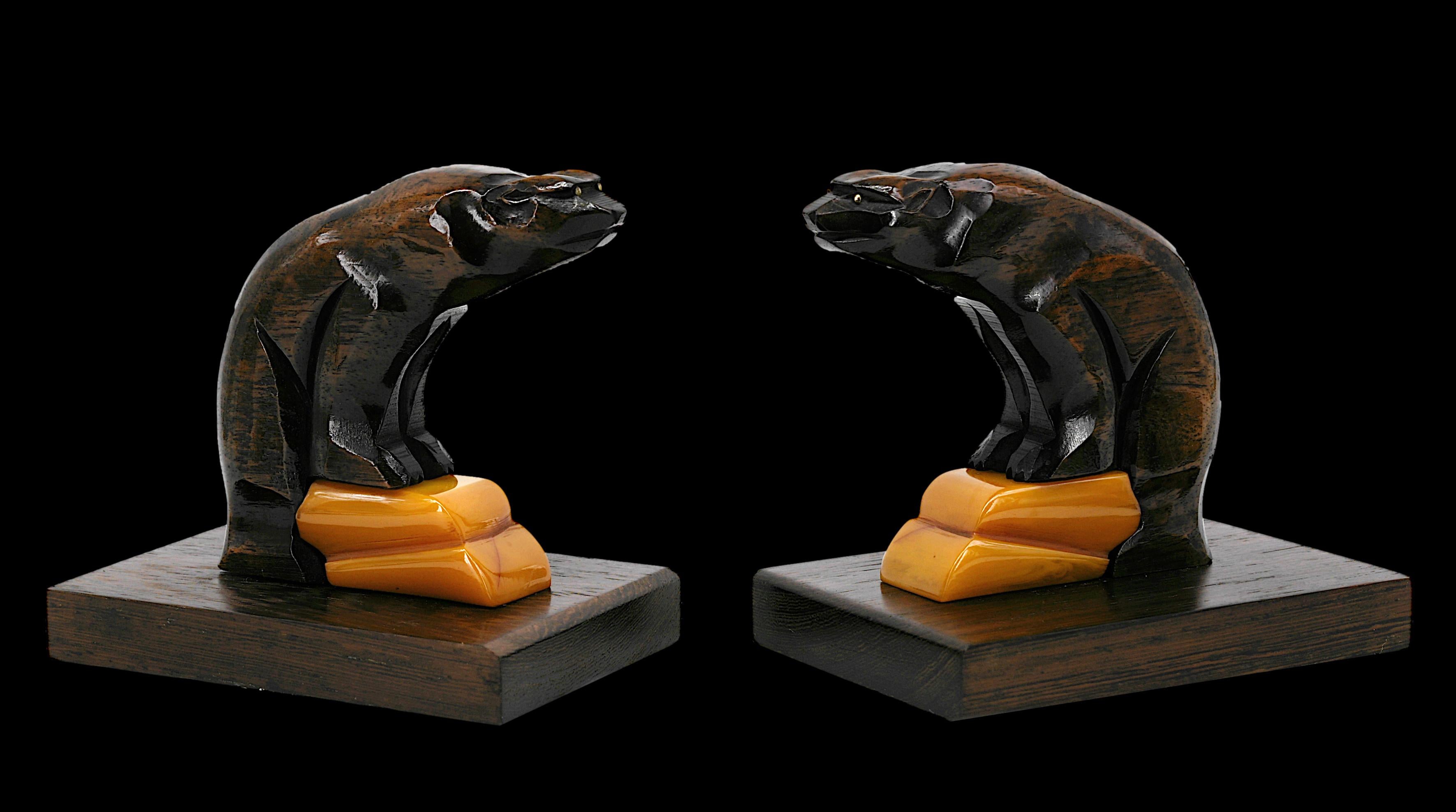 French Art Deco bookends, France, 1930's. Two bears. Noble woods and bakelite. Brass eyes. Measures: each - height: 4.7