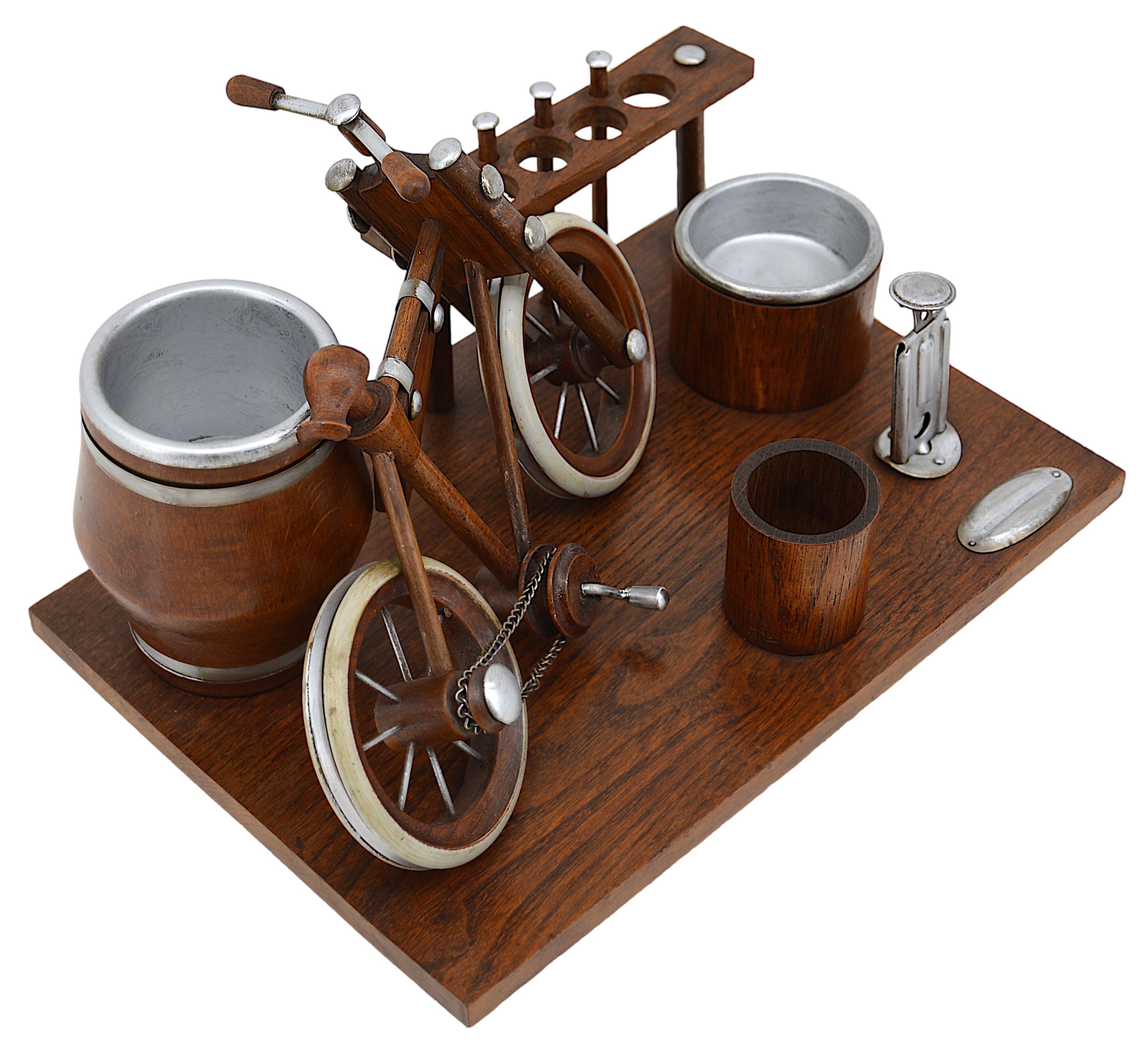 French Art Deco bike themed smoking set, France, 1930's. Oak and pewter. Smoking set dating from the 1930s on the theme of the bicycle. There is a bicycle, of course, which is only decorative, a barrel for cigarettes, a place for tobacco and another