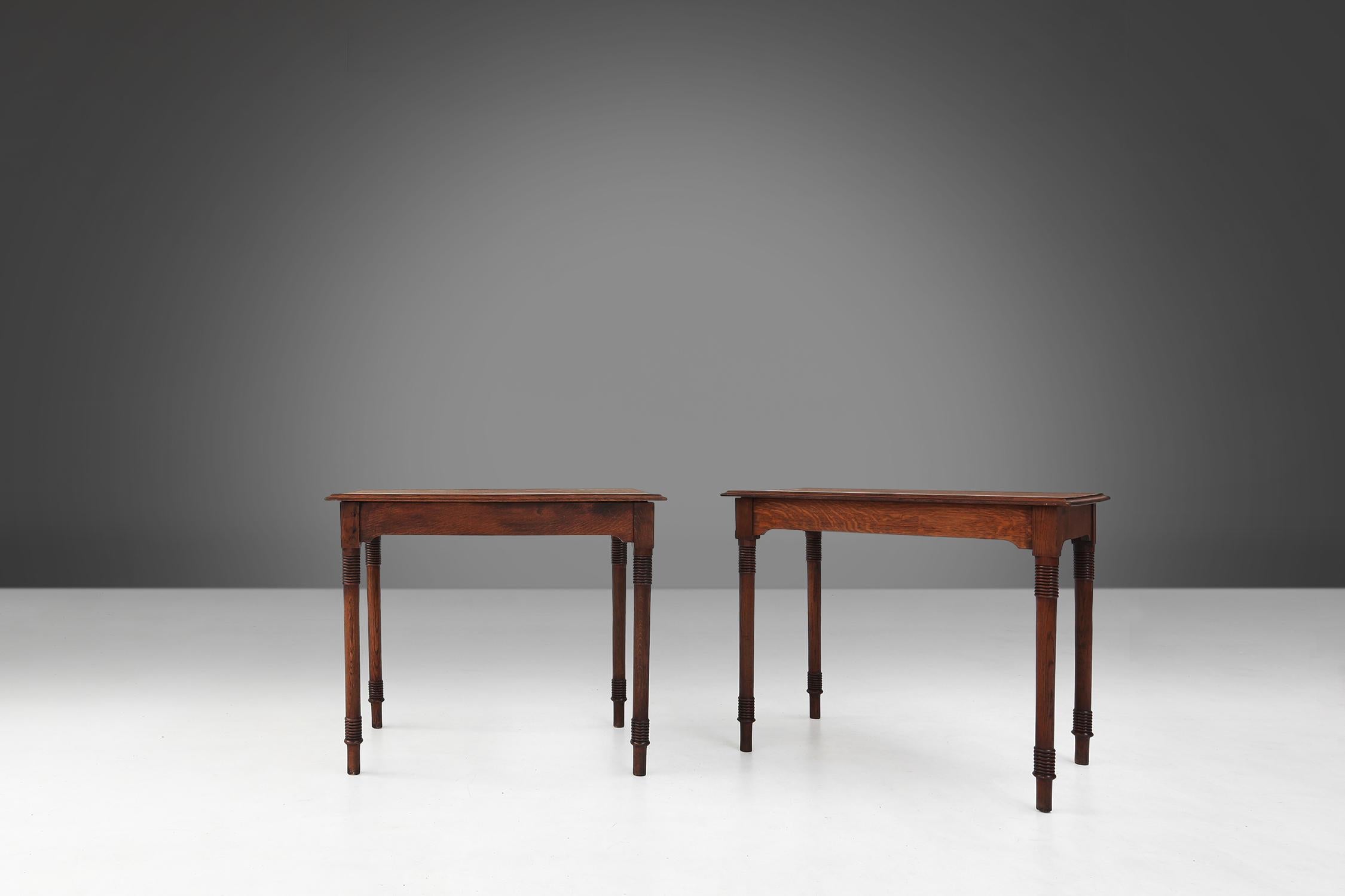 This beautiful set of two rectangular tables. They are made of wood and the most striking thing about these tables are the beautiful details in the legs, which are typical of the art deco style. The legs have a decoratived shape and are decorated