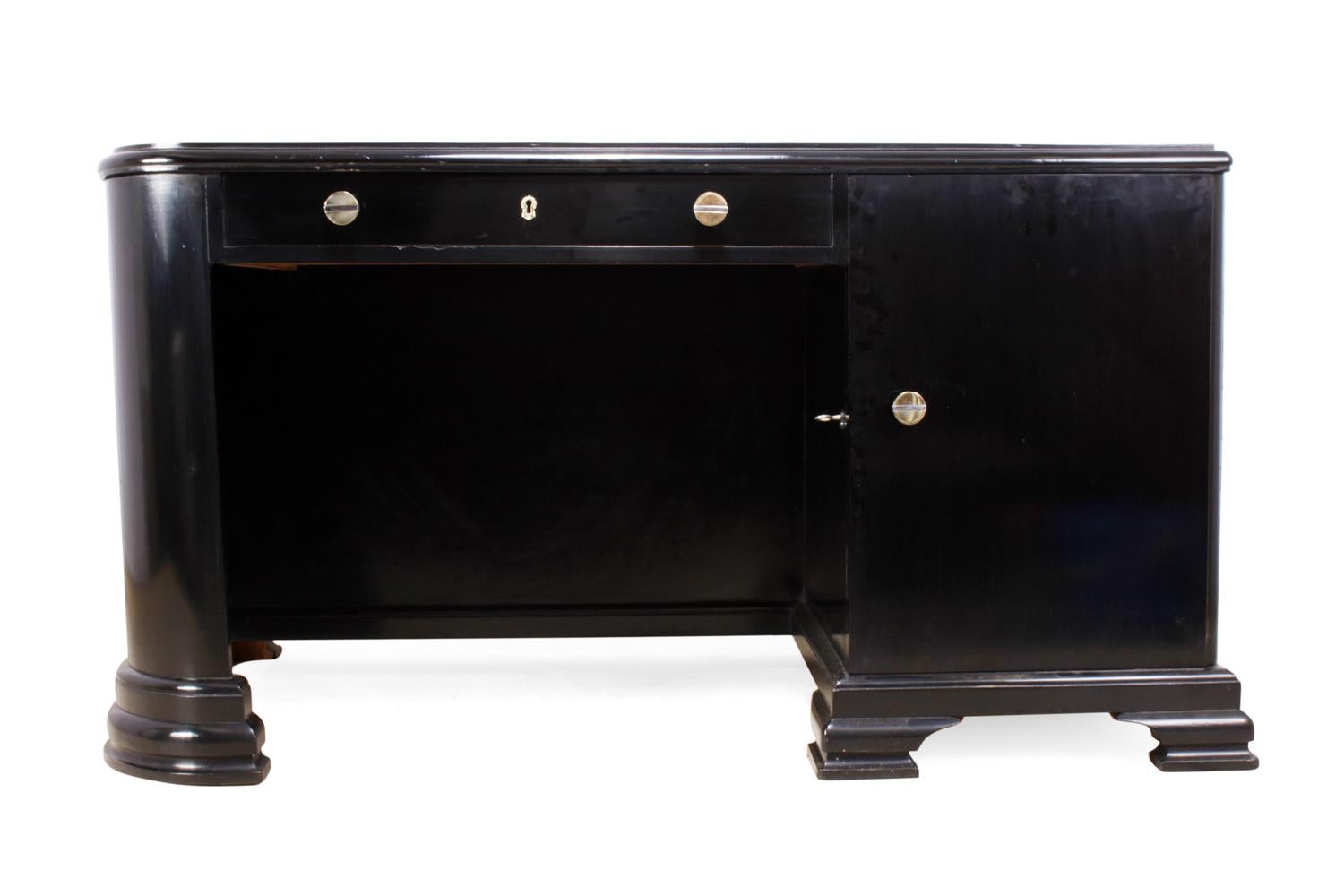 French Art Deco black desk
This French desk was produced in the 1930s, it has a new leather inset top, lockable door with drawers behind and top drawer, the desk is free standing with a bookshelf to the rear and is in excellent condition having