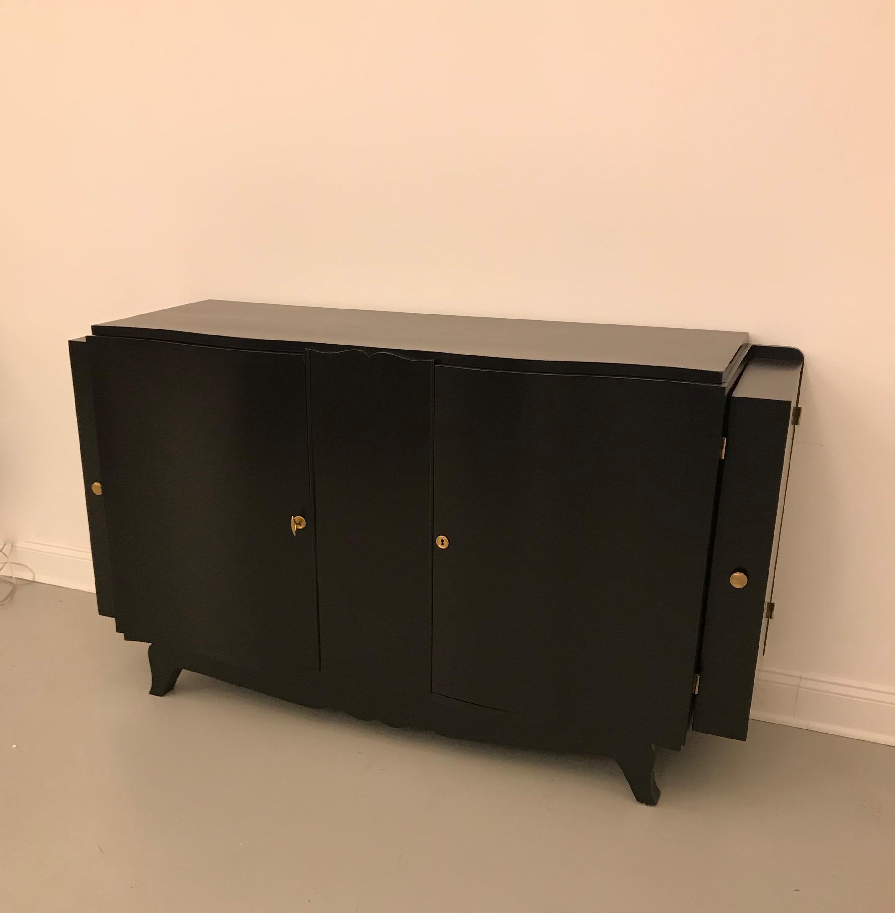 Stunning French Art Deco black lacquered sideboard or buffet with dry bar. Two hidden secret cabinets on the end of the buffet open to reveal a dry bar.
 