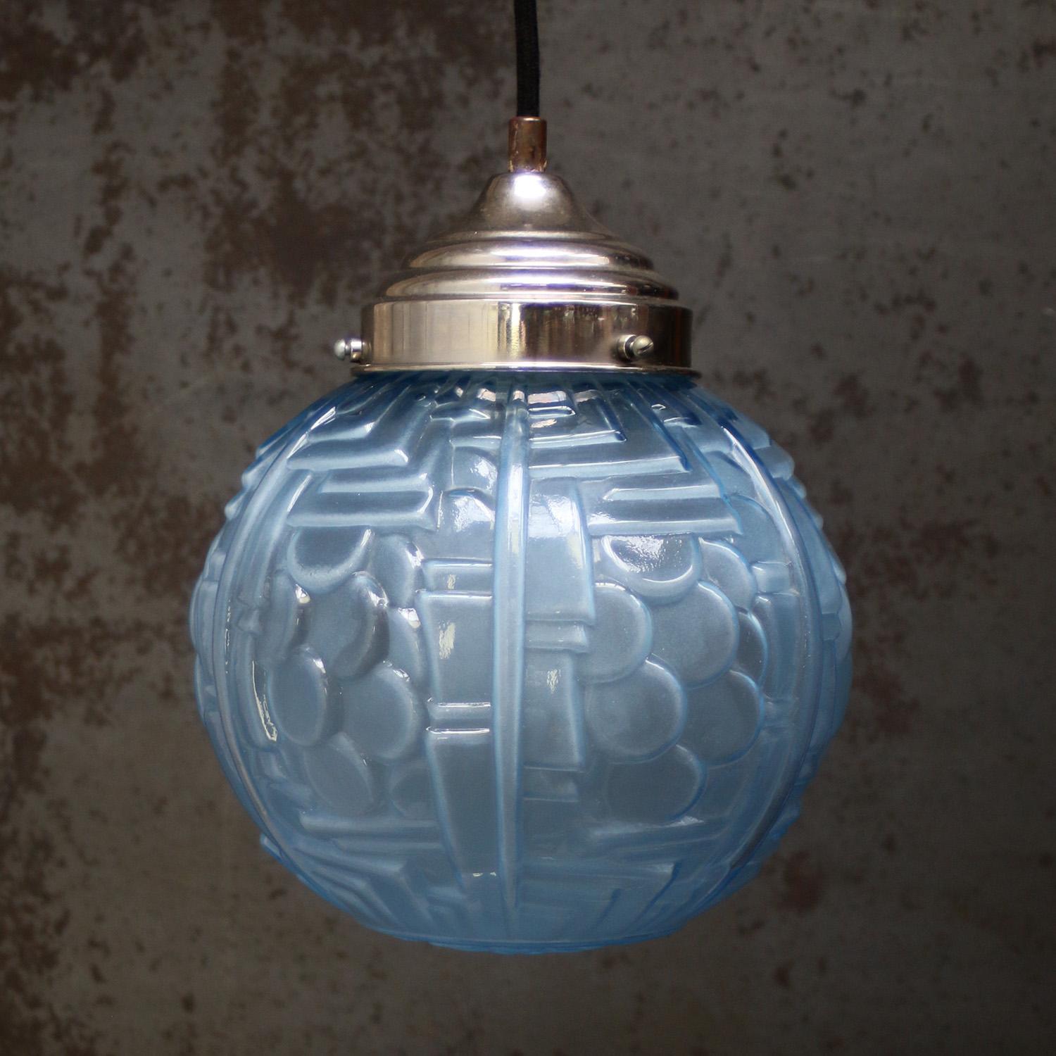 1920 French Art Deco blue glass pendant lamp
Nickel glass holder

Weight: 1.30 kg / 2.9 lb

Priced per individual item. All lamps have been made suitable by international standards for incandescent light bulbs, energy-efficient and LED bulbs. The