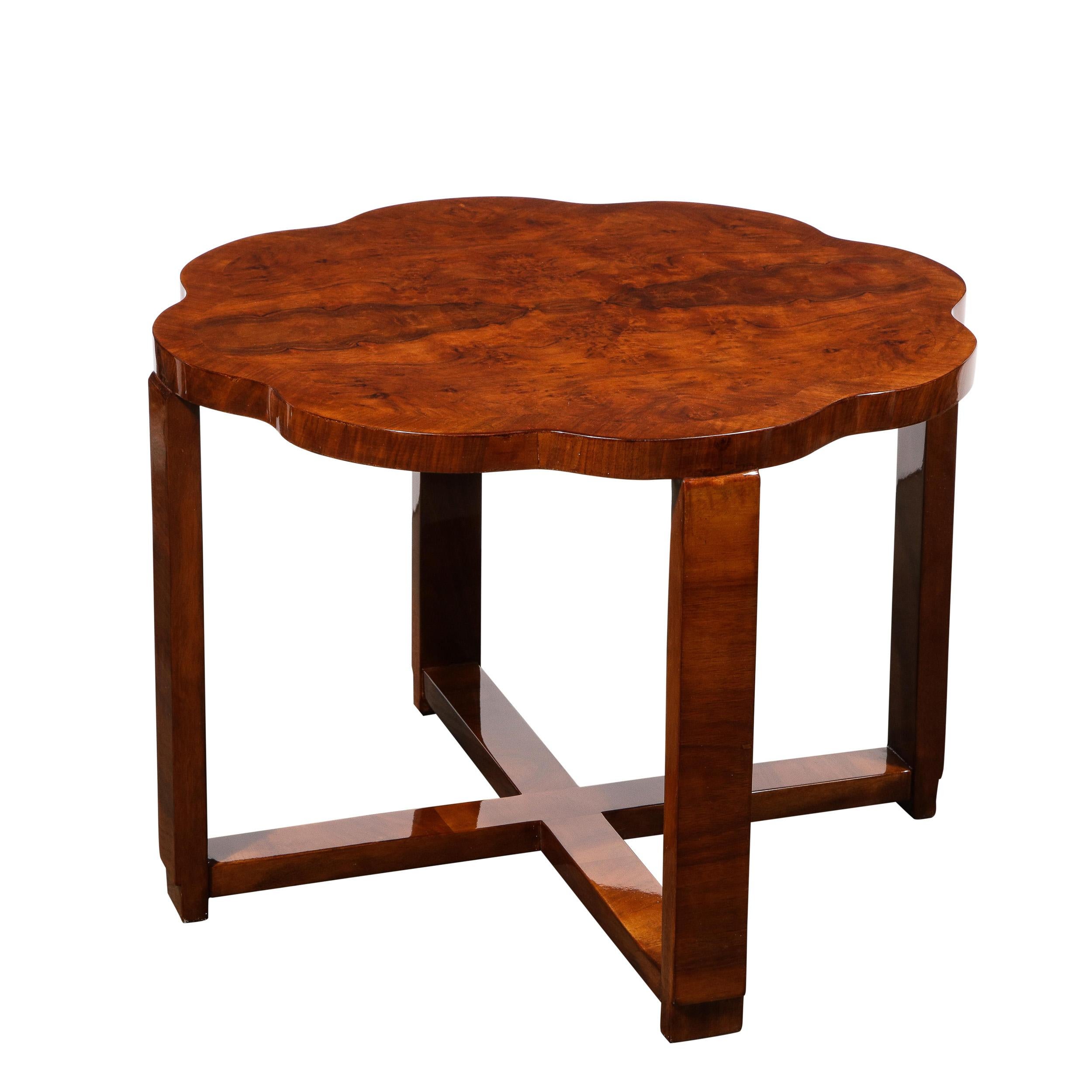 This elegant Art Deco table was realized in France, circa 1930. It offers a scalloped 