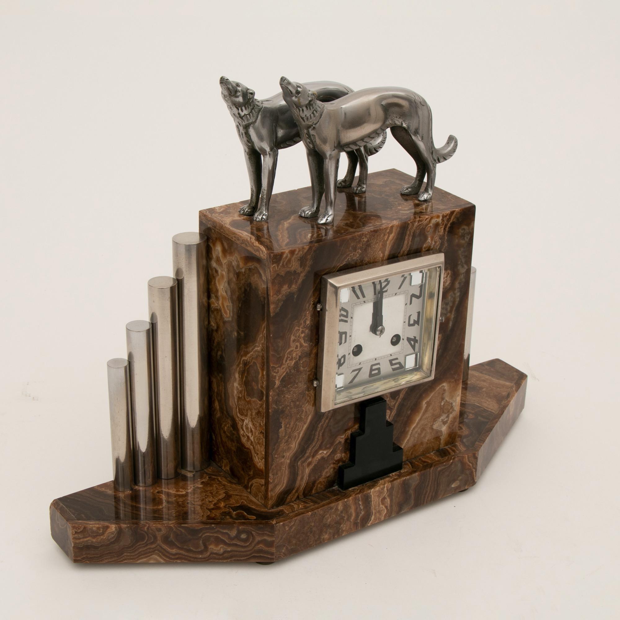 An impressive French Art Deco clock with silvered bronze Borzoi dogs and illuminating garnitures by Michel Decoux. Both dogs signed bronze.
Good working order
Clock - H: 38cm W: 47cm D: 13cm
Lamps - H: 31cm W: 10cm D: 10cm
French, circa 1930.