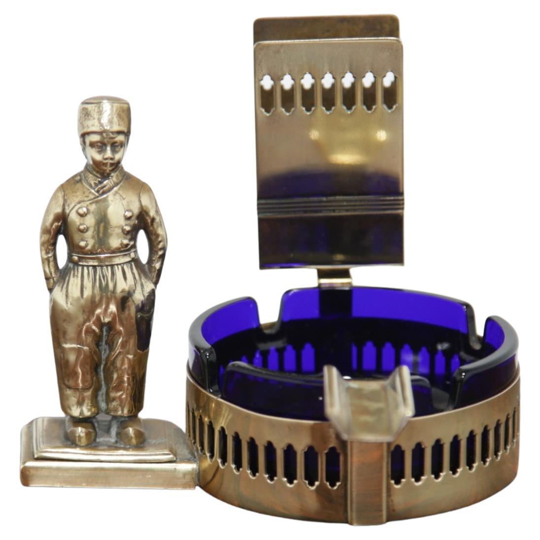 French Art Deco Brass and Cobalt Blue Glass Ashtray with Bellboy Figure, 1930s