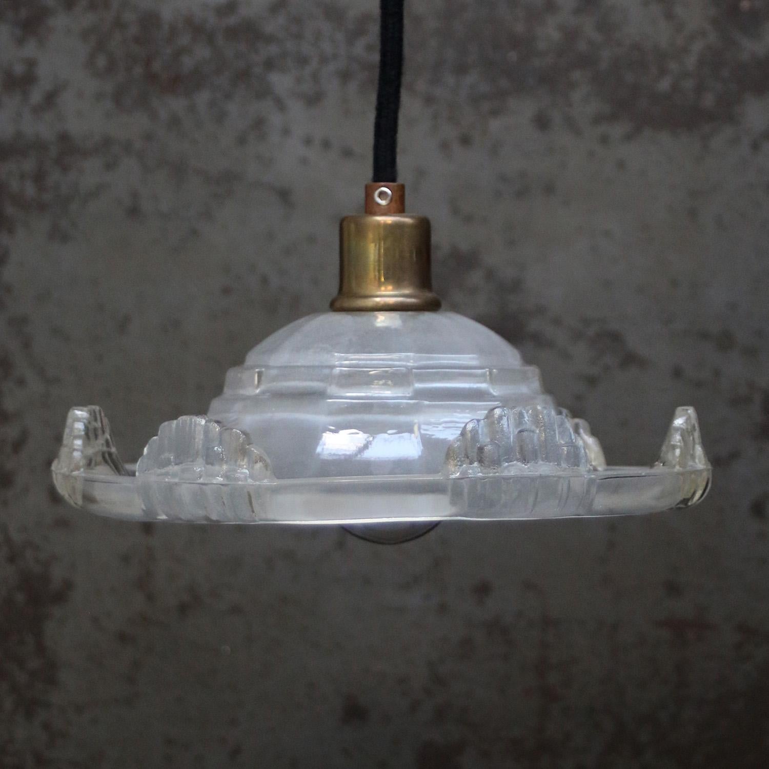 1920 French Art Deco clear, etched glass pendant lamp
Brass glass holder

E14 bulb holder

Weight: 1.10 kg / 2.4 lb

E14 bulb holder. Priced per individual item. All lamps have been made suitable by international standards for incandescent light