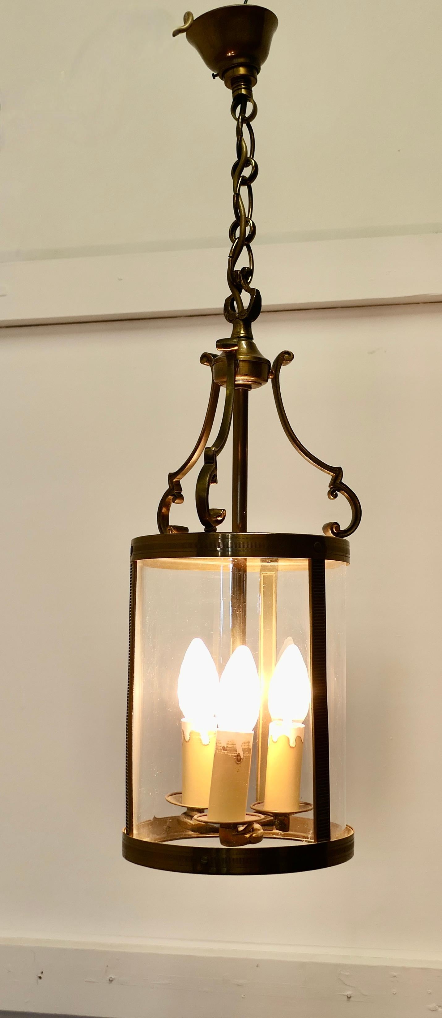 French Art Deco Brass Glass Lantern Hall Light

A superb quality brass lantern, the light is circular and it hangs on a chain and has brass ceiling rose
The lantern gives a bright light when lit with the 3 bulbs
The lamp is in good working