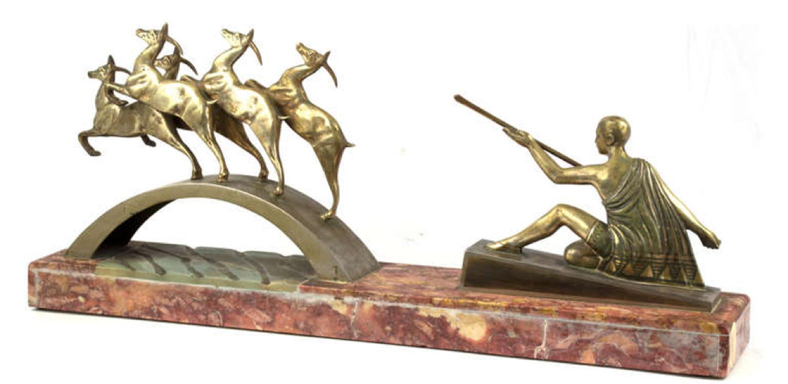 A multi-figural statue of bronze figures on a rose-colored onyx plinth. Made in France, the work is heavily influenced by the work of Paul Manship (American, 1885-1986) who created several works juxtaposing sculpted groups and multiple media. This