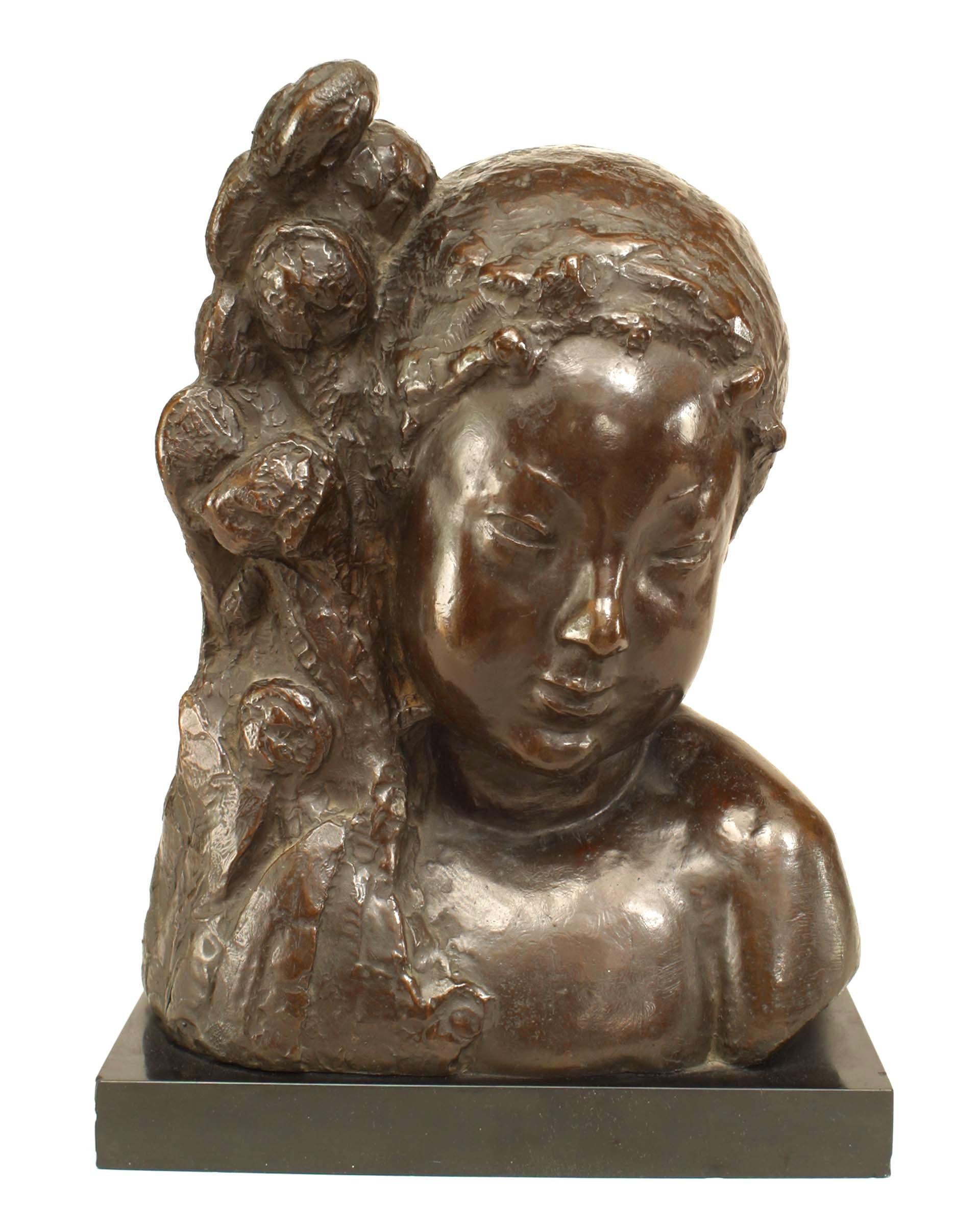 French Art Deco bronze bust of a nymph leaning by a floral arrangement on a black marble base (signed: N. ROY and marked J. LAMY FOUNDEUR, CHATILLION, SEINE)
