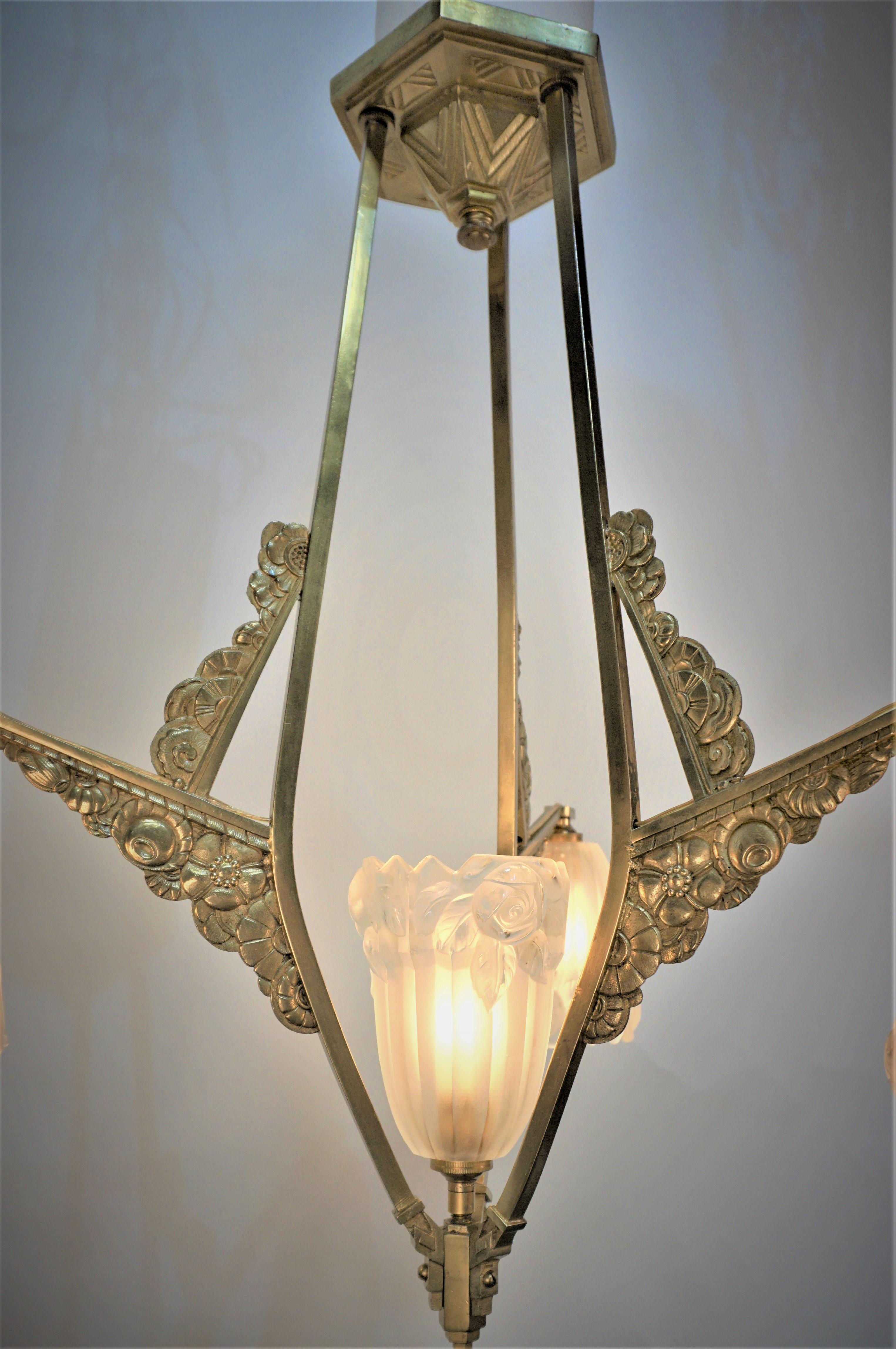 Beautiful bronze Art deco chandelier with four clear frost glass shades by J. Robert.
Professionally rewired and ready for installation.