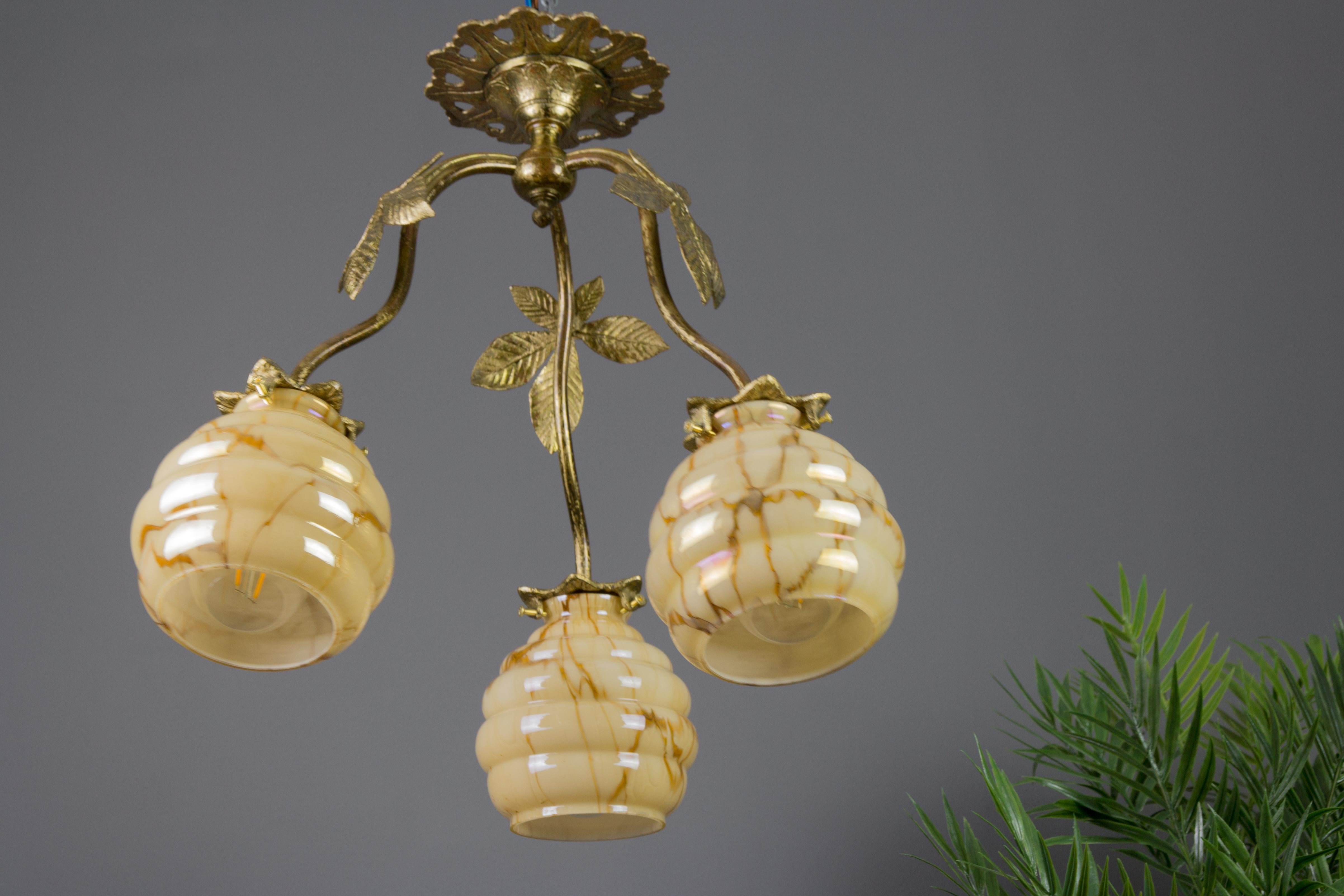 Mid-20th Century French Art Deco Bronze and Marbled Glass Three-Light Chandelier