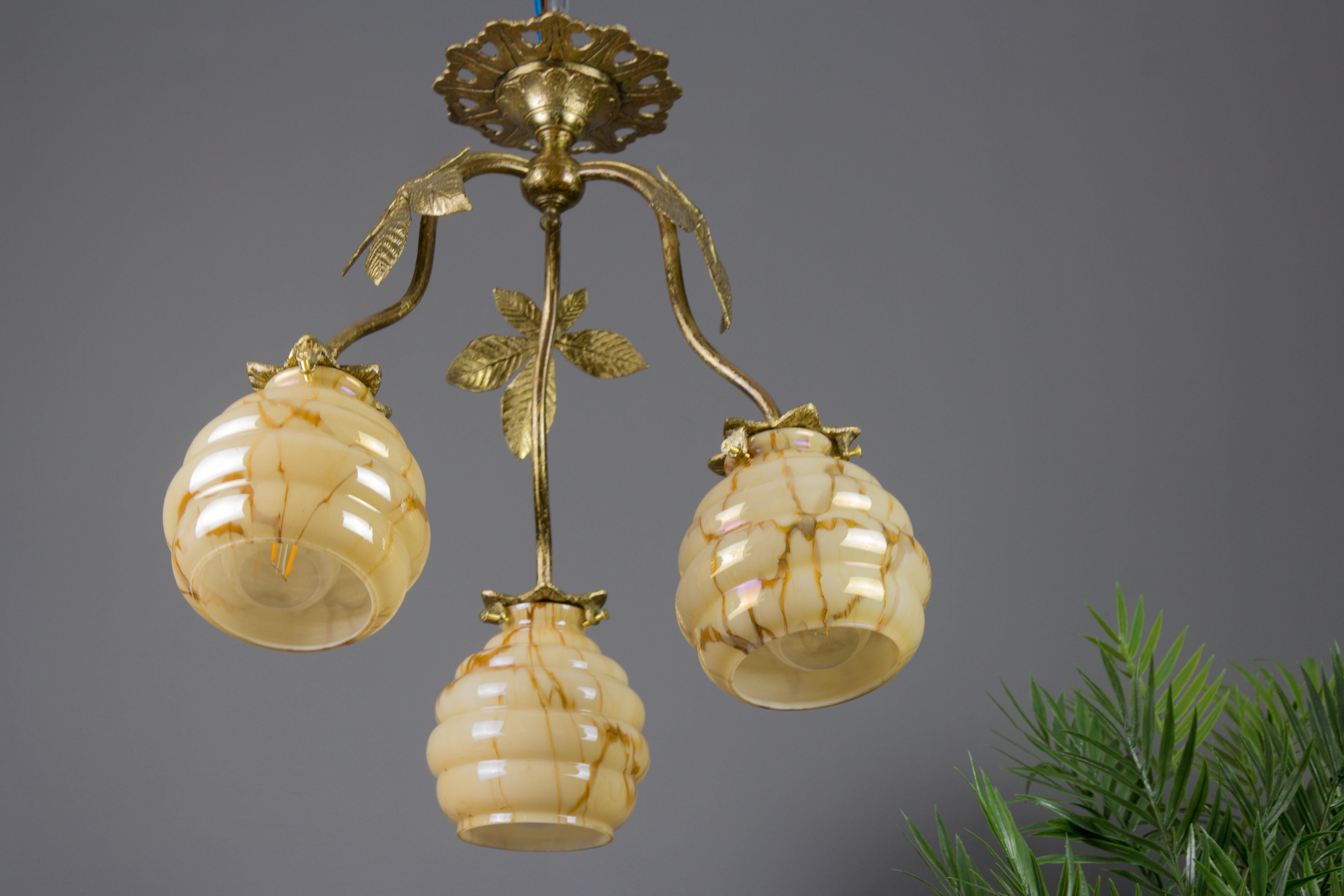 Brass French Art Deco Bronze and Marbled Glass Three-Light Chandelier