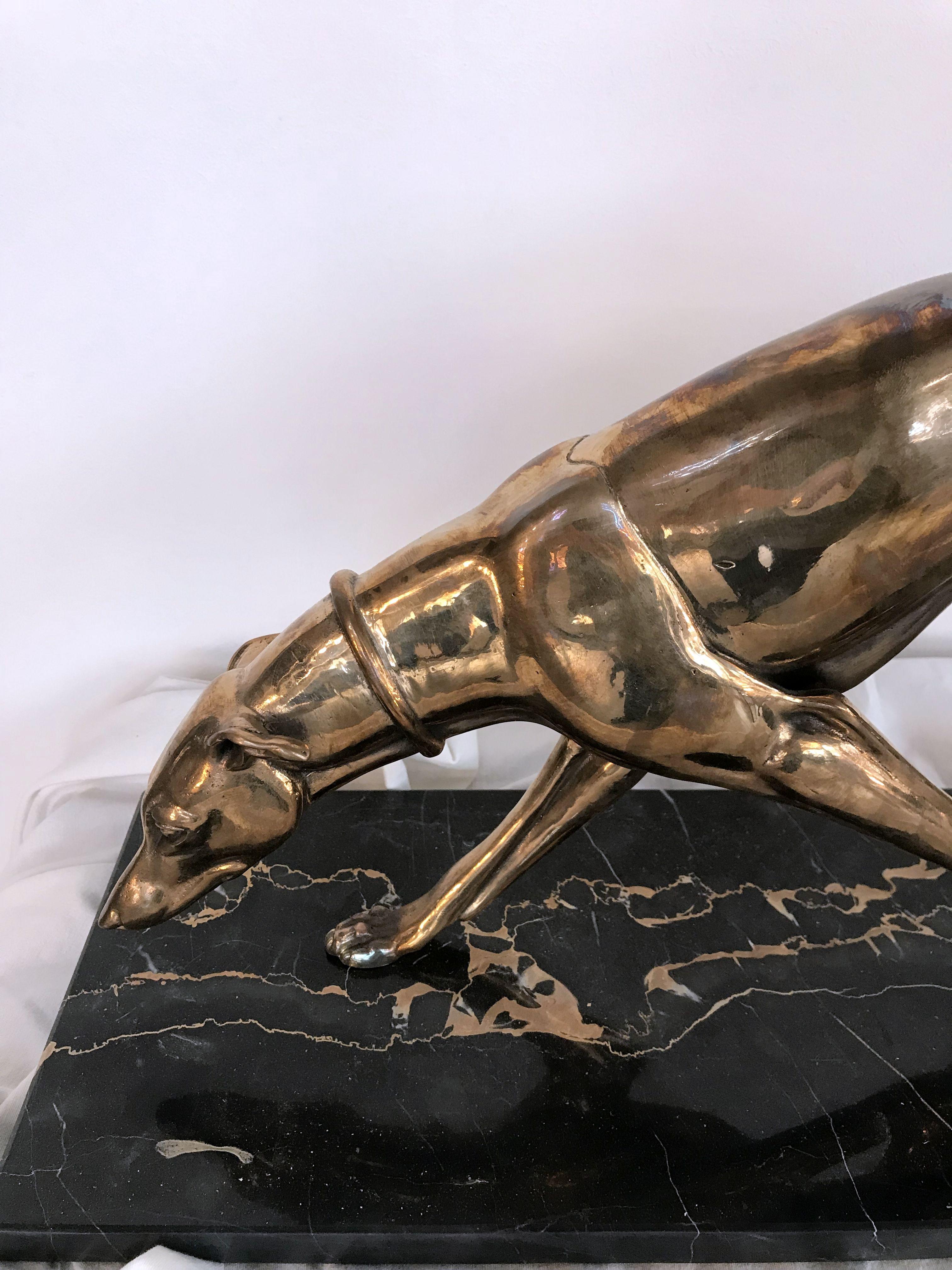 Bronze polished Art Deco sculpture on original marble base. Greyhound as this item was liked figure in Art Deco period.