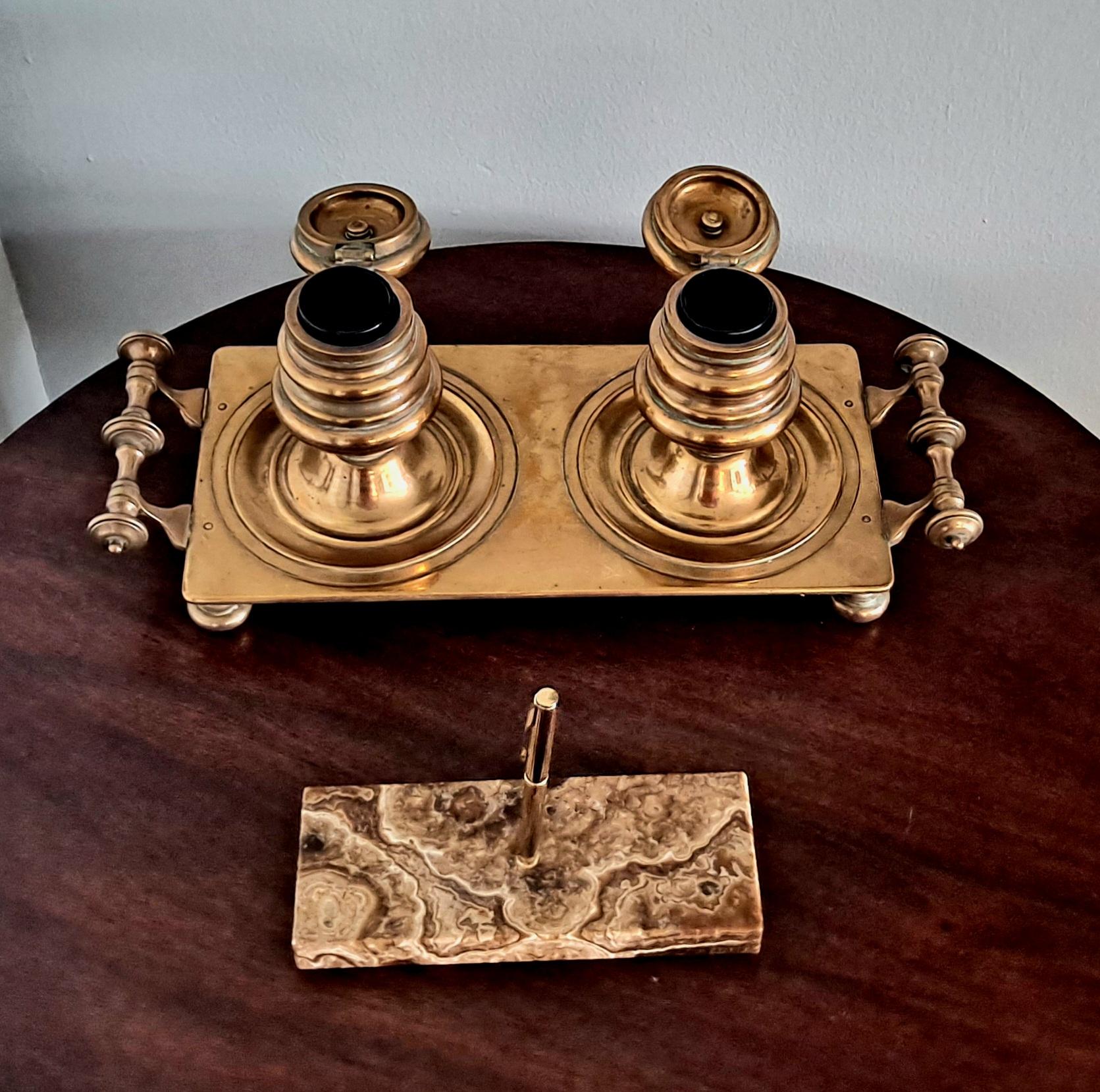 This is a top original Art Deco quality made desk piece. Besides an intricately decorated large pair of inkwell holders this work of beauty also comes with a pair of perfect size and shape, bronze handles. The lids of this rare collectable open and