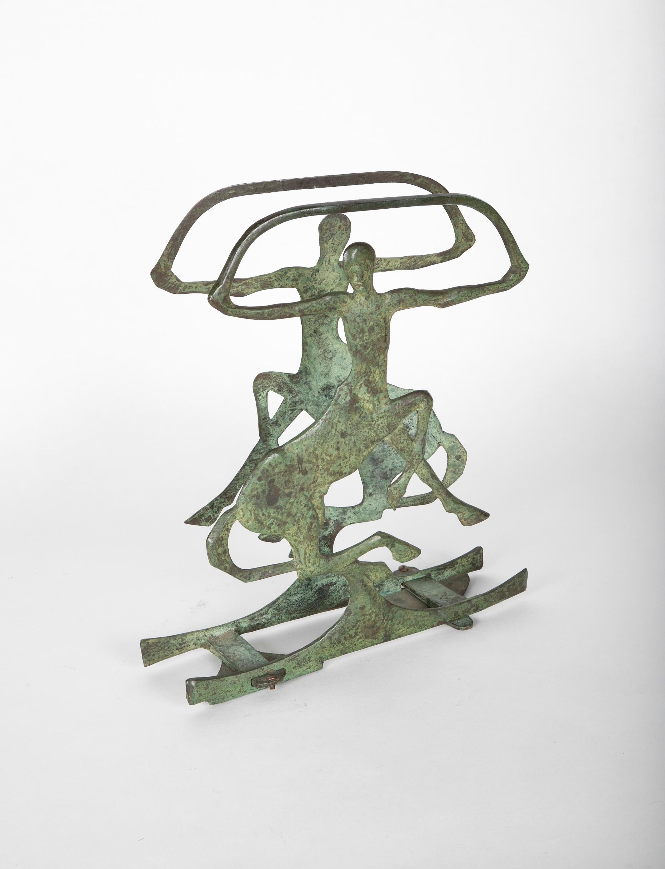 Beautifully designed and very unusual cast bronze magazine of book rack showing two centaurs rearing and with arms out stretched, with subtle verdigris patina. 
Whether used as a holder for magazines or just a unique piece of sculpture, this is a