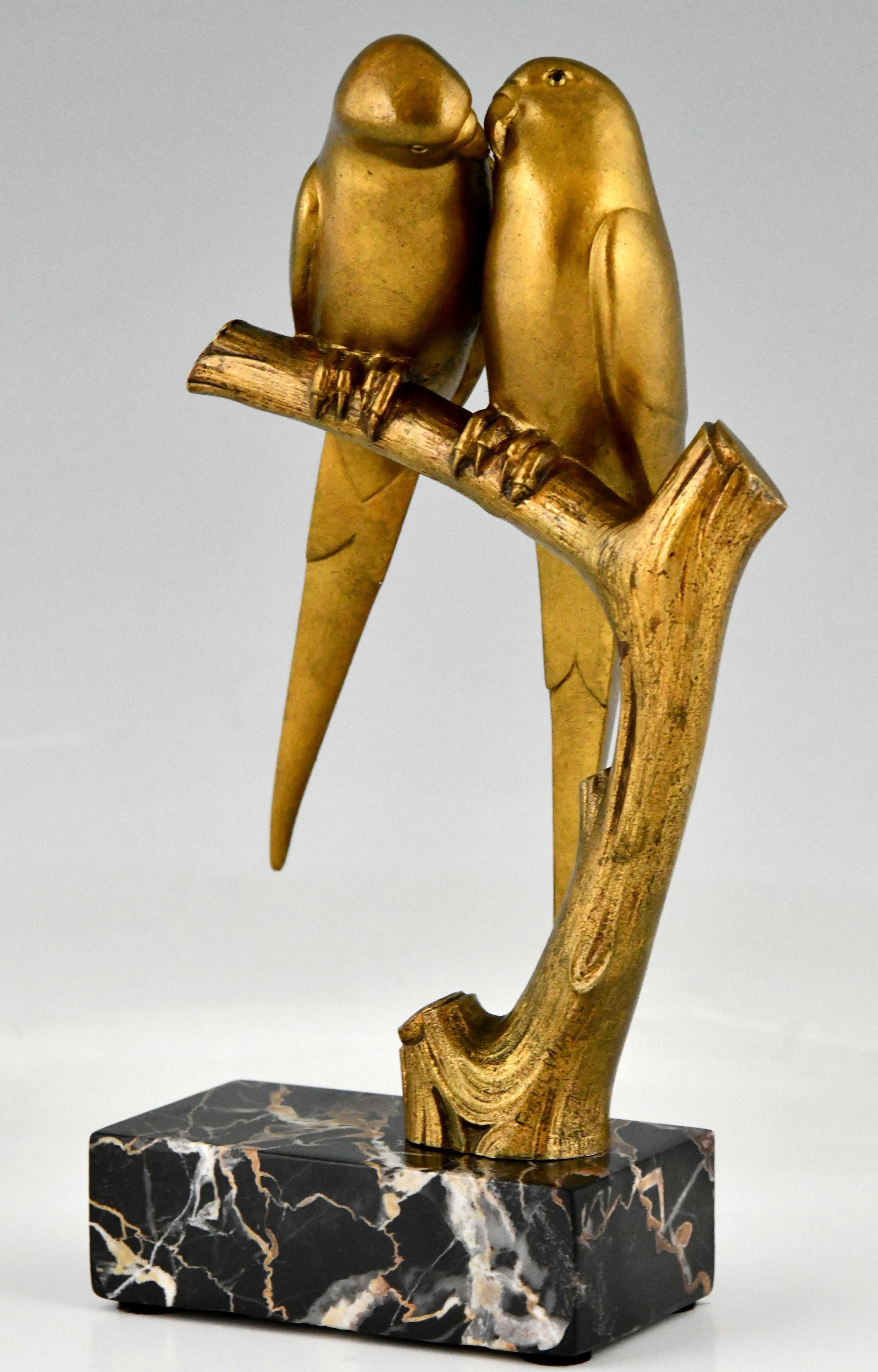 Art Deco bronze sculpture of two parakeet birds on a branch, lovebirds. The statue is signed by Paul Marec. Gilt bronze on a Portor marble base. France 1925.