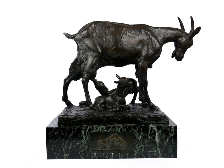 A fine lost-wax modernist sculptural group of a mother goat and her two kids by Georges Lucien Vacossin, the work is beautifully cast with a silky surface over a complex golden-brown, dark brown and black patina. The textured surface of the animals