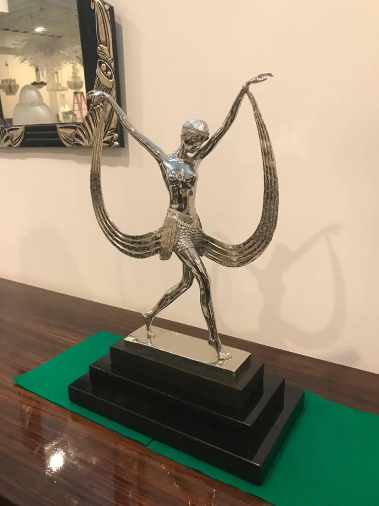 A beautiful signed bronze French Art Deco female sculpture by Cluad Mirval. The deco dancer is plated in polished nickel on three stepped black marble base. The sculpture is signed C Mirval.

 