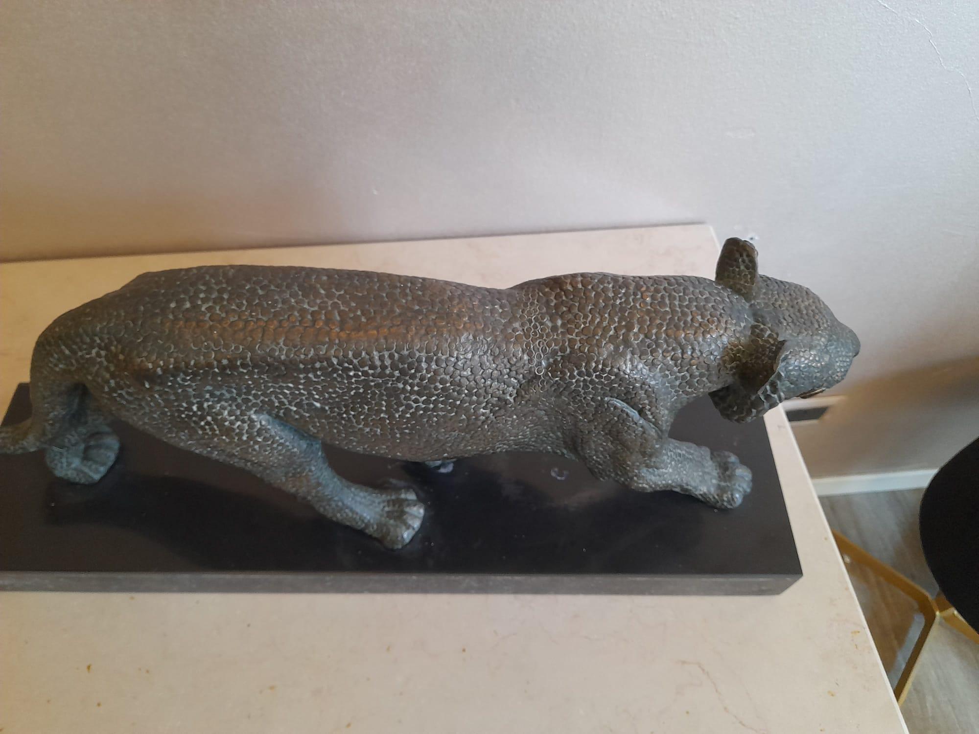 French 1930s Art Deco Bronze Sculpture representing a Panther Signed by Rulas.
This sculpture comes on its black marble base. 
The signature is on the marble base. 
Size of this piece are: 55 x 14 cm, h 24 cm.
Good conditions, wears coherent with