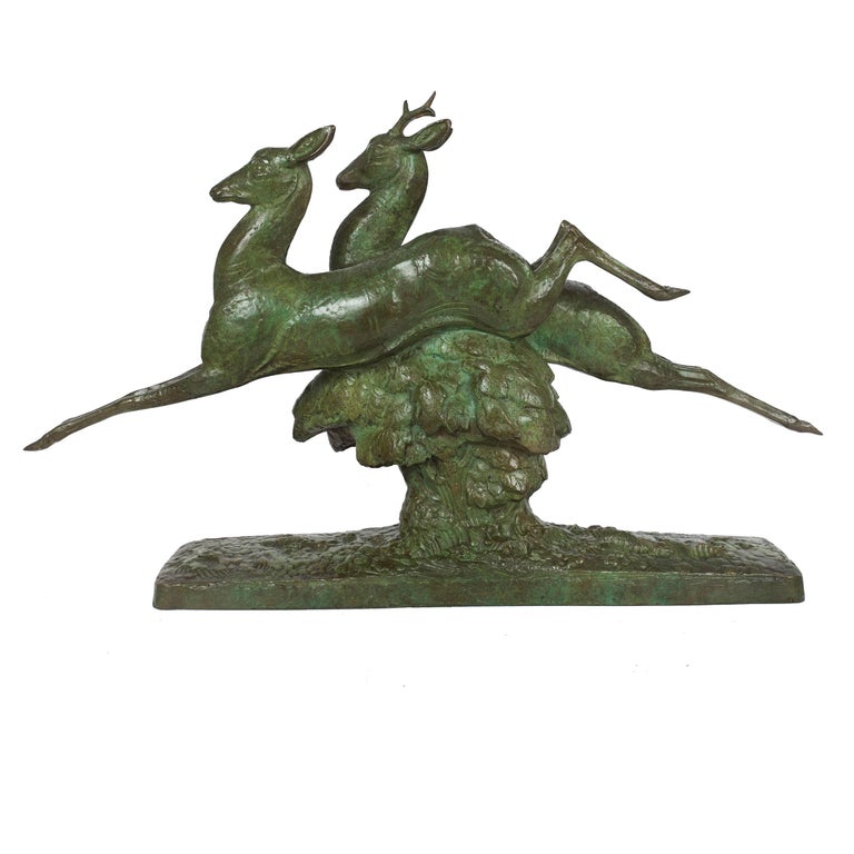 An exquisite and rare Art Deco bronze sculpture of a Leaping Stag and Hind circa 1930-40, the model is sealed with the Susse Freres foundry cachet and Becquerel's signature is captured directly from the mold and transferred into the bronze. There is