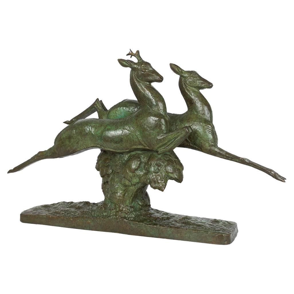 Französische Art Deco Bronzeskulptur "Springender Hirsch und Hirschkuh" von André-Vincent Becquerel