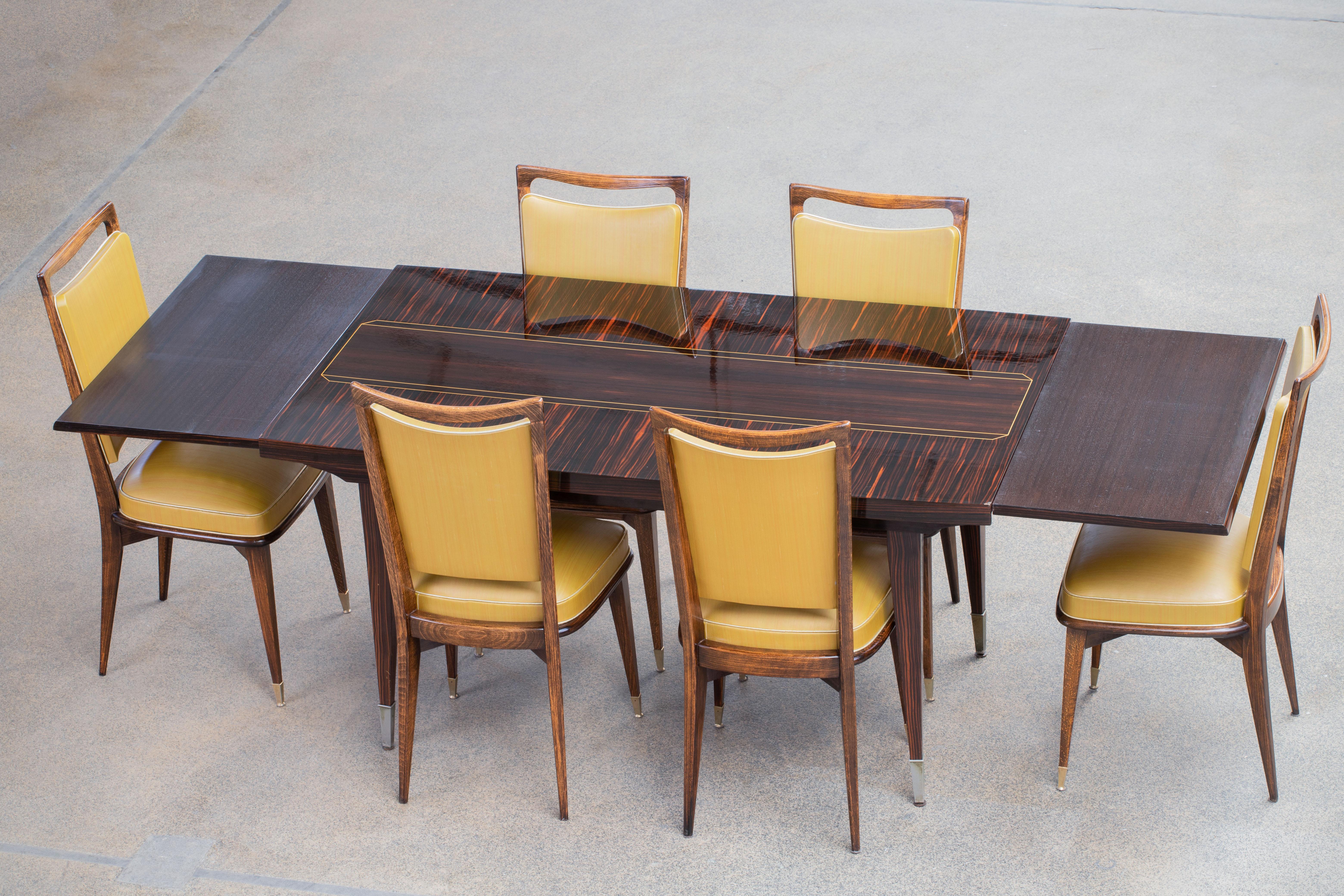 Dining table, Macassar, France, 1940s.

Majestic centre table in Macassar. This Art Deco table shows great craftsmanship. The base and legs are beautifully detailed. This table has an elegant appearance. This design combines the more feminine and