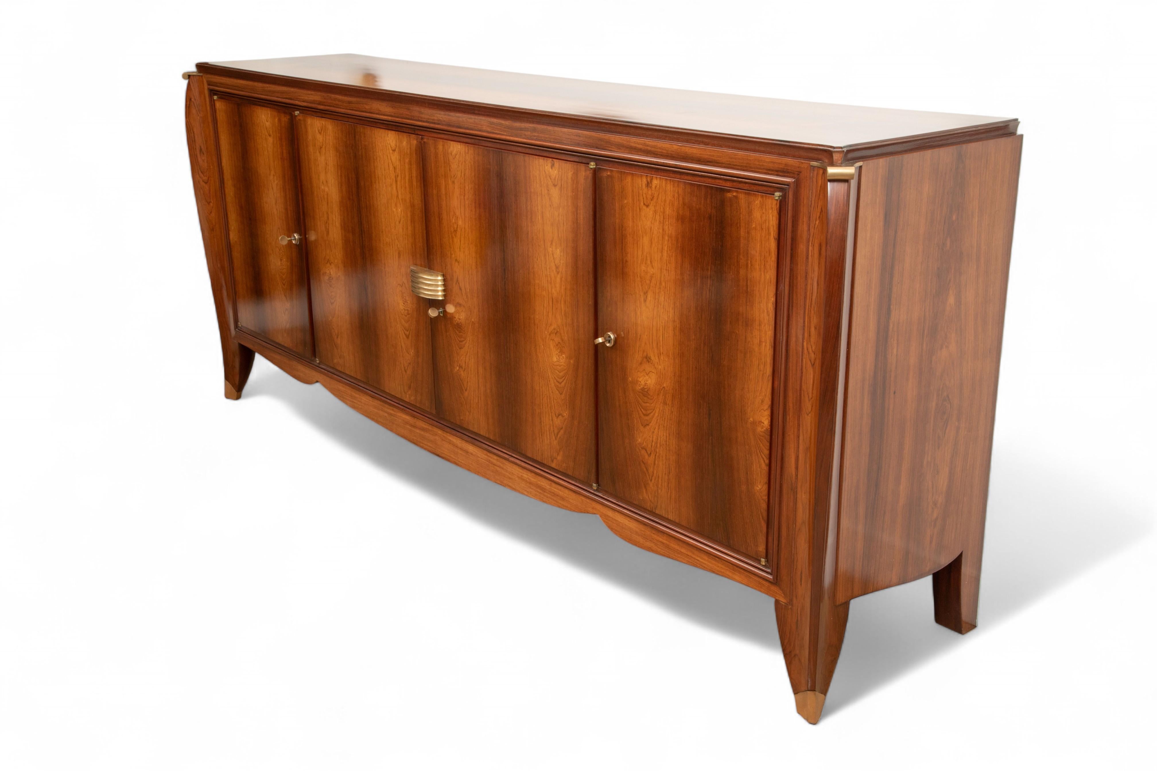  French Art Deco Buffet by Maurice Rinck, France, circa 1935

Exquisite French Art Deco buffet by Maurice Rinck, France, circa 1935. This elegant sideboard exemplifies the refinement and craftsmanship of the Art Deco period, featuring rich wavy