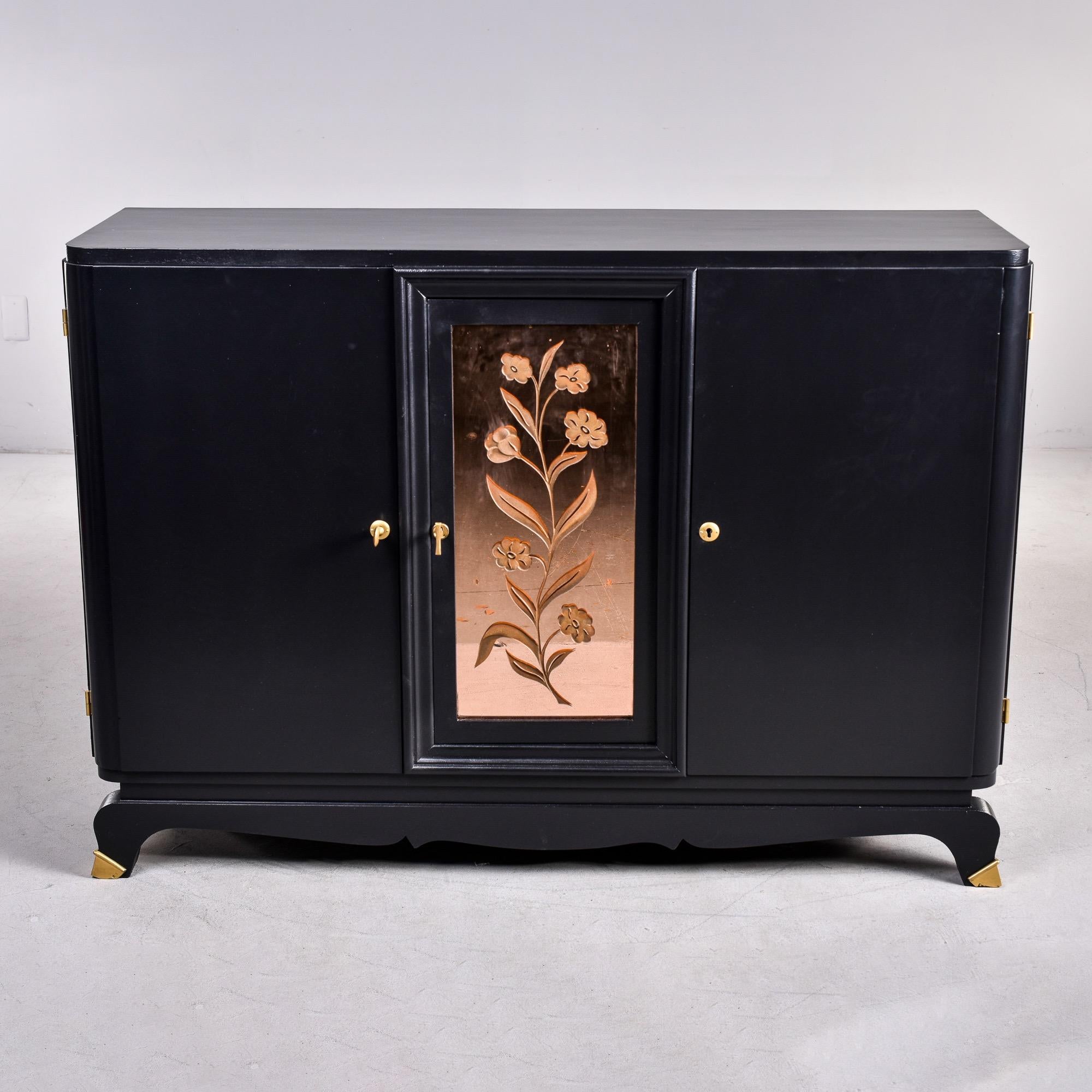 Found in France, this circa 1930s buffet cabinet has a new black finish and peachy pink etched mirrored panel in the center Each side cabinet has a functional lock and key and opens to a compartment with one internal adjustable shelf that has inlay