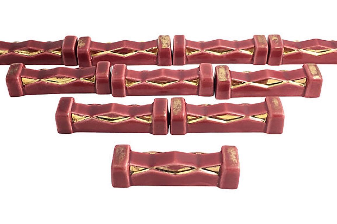 French Art Deco Burgundy and Gold Knife Rests, Set of 10 For Sale 1