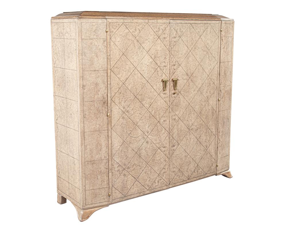 Introducing our stunning French Art Deco Burled Walnut Armoire Cabinet, a true masterpiece of furniture design. This exquisite piece is expertly crafted out of the finest burl walnut, known for its striking grain patterns and rich color variations.