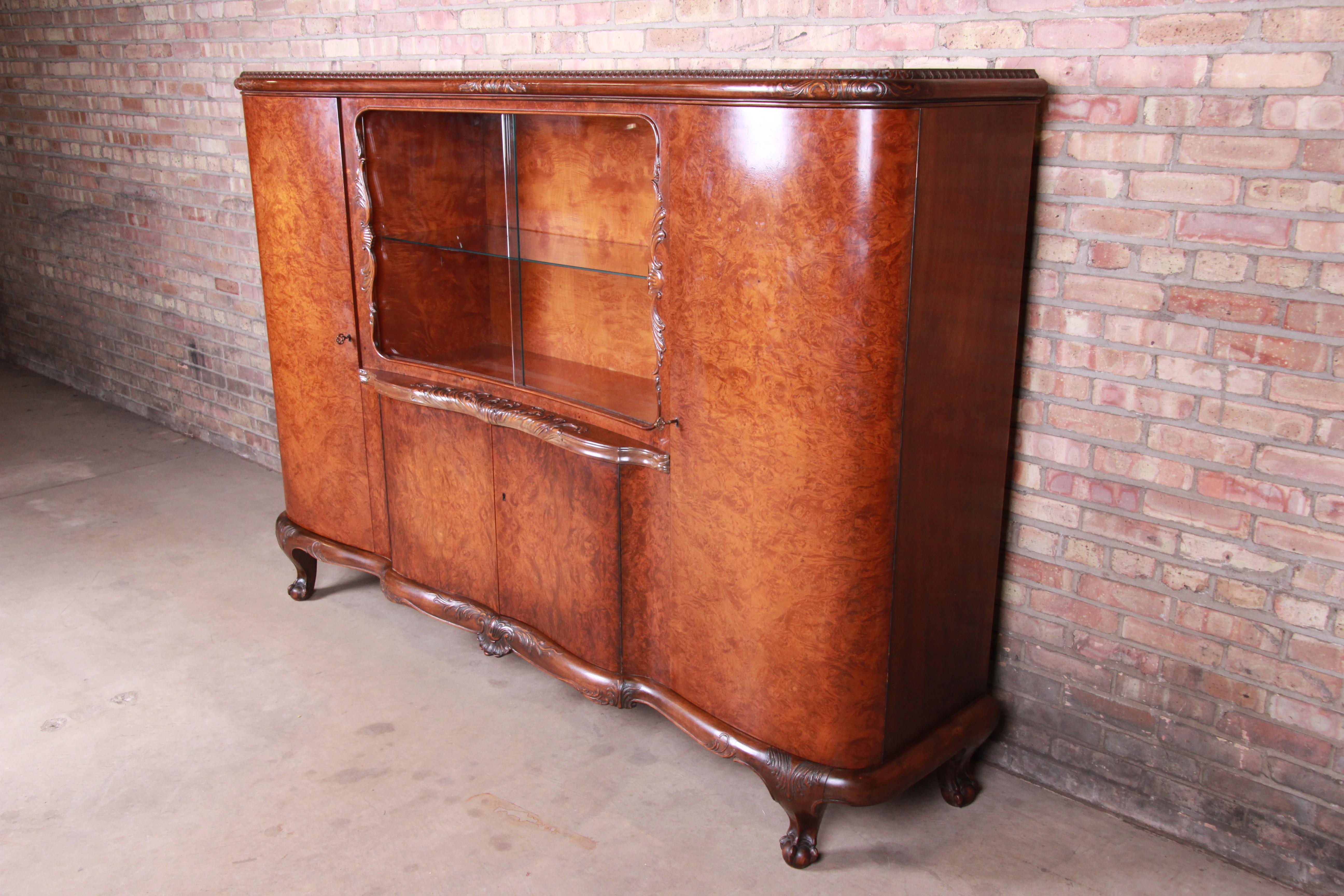 An exceptional French Art Deco burled walnut bar cabinet, sideboard, or bookcase,

circa 1930s

Measures: 89.5
