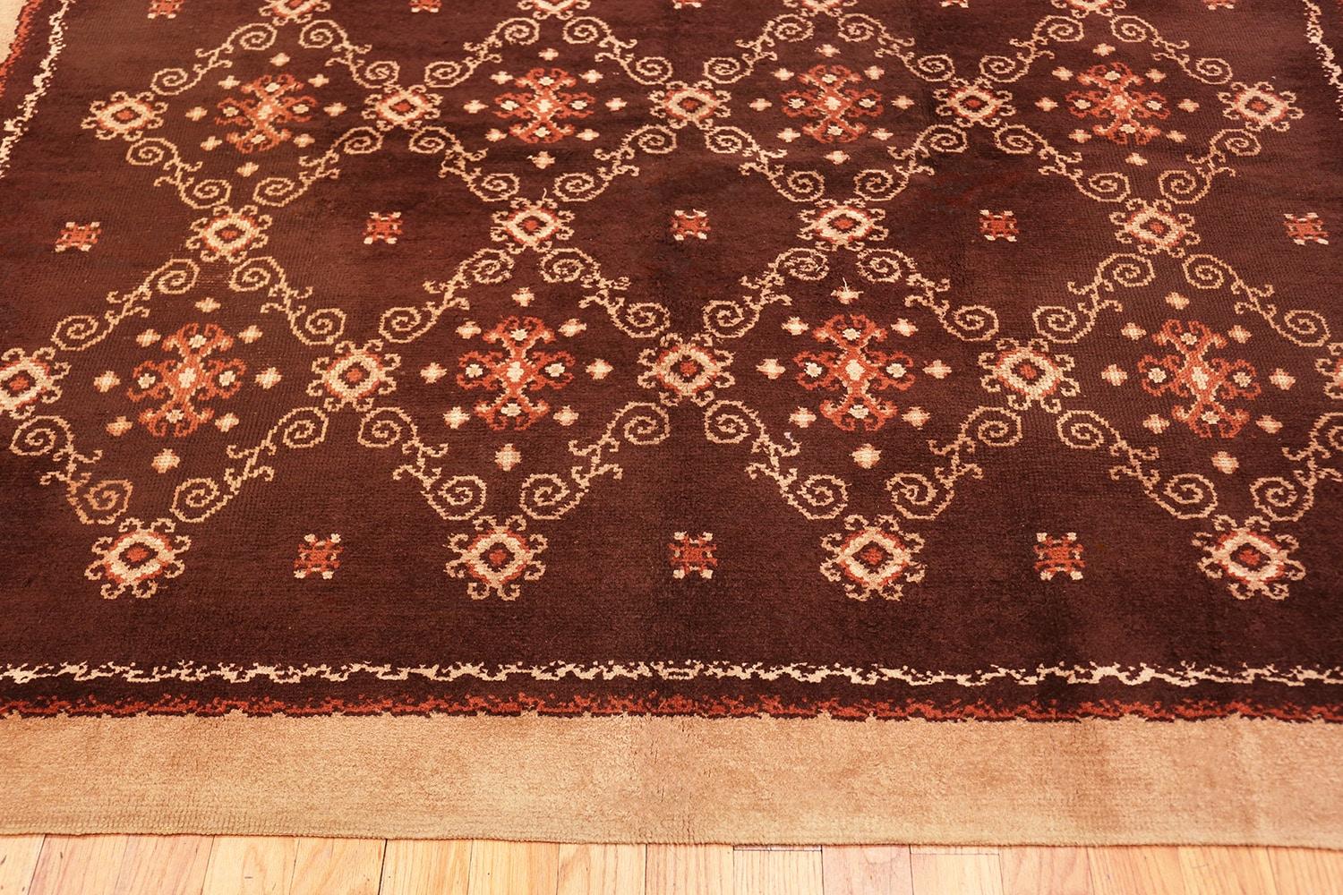 Art Deco carpet by Kinheim, country of origin: France, circa 1920. Size: 7 ft. 4 in x 10 ft. (2.24 m x 3.05 m)

Elegant simplicity defines this antique carpet, allowing the bold, yet subtle movements to speak for themselves amidst the collection of