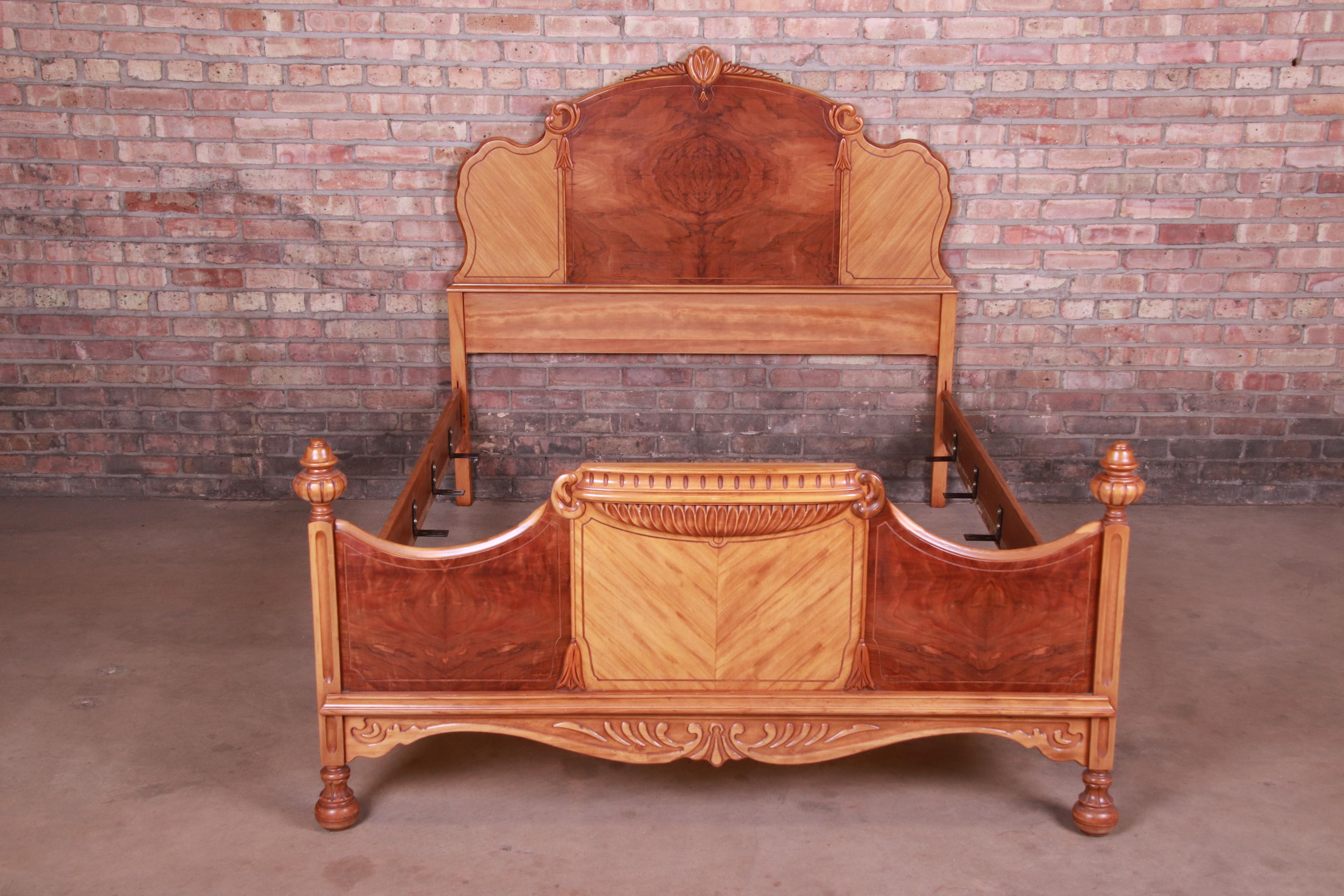 A gorgeous French Art Deco style full size bed frame,

circa 1930s

Burled walnut, with carved and inlaid satinwood.

Measures: 58