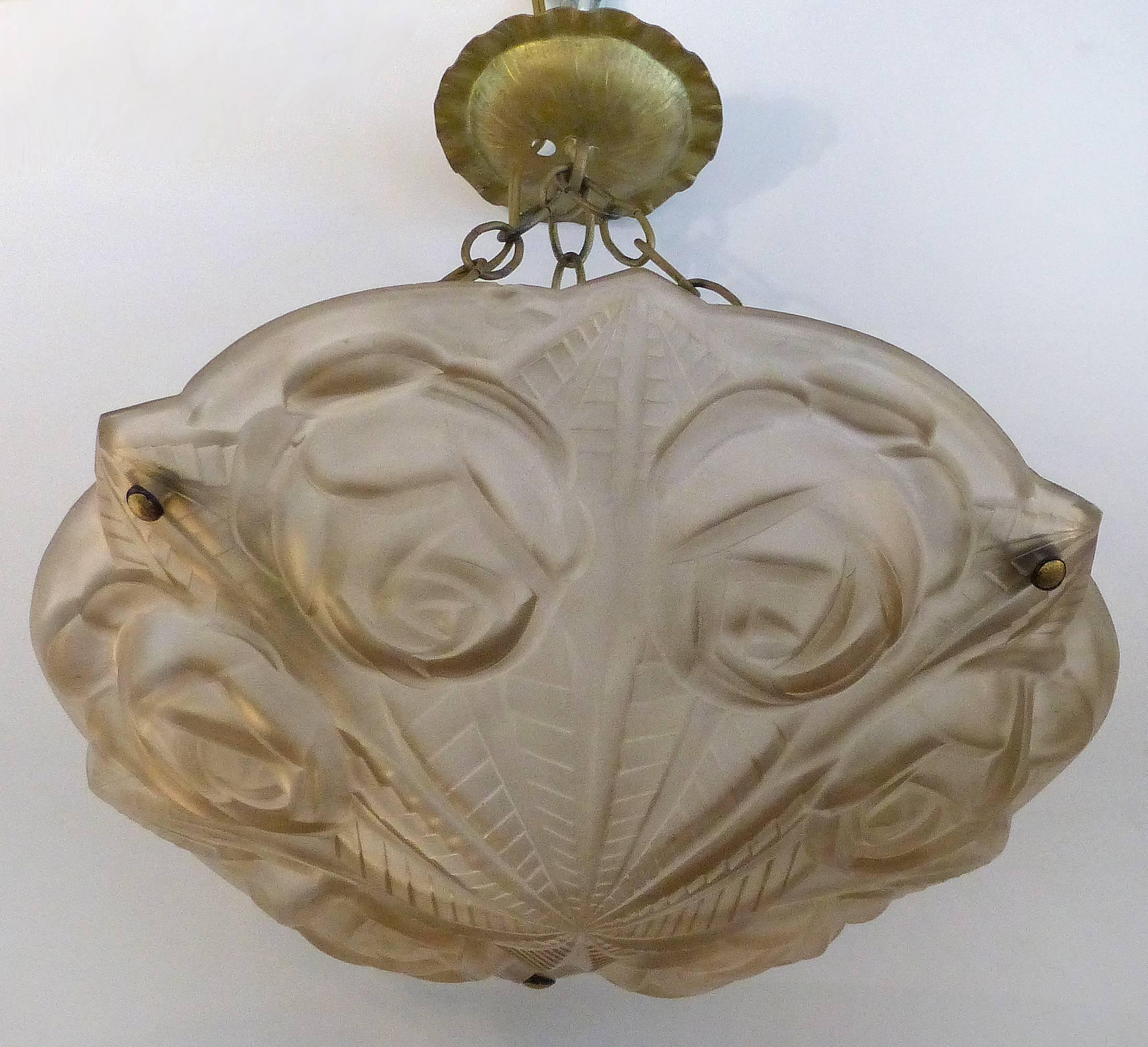 Degue French Art Deco Cast Mauve Glass Pendant Chandelier, Signed, circa 1930

Offered for sale is a French Art Deco pendant light fixture signed Degue, circa 1930. The cast glass has a floral pattern with roses and is etched with the Degue