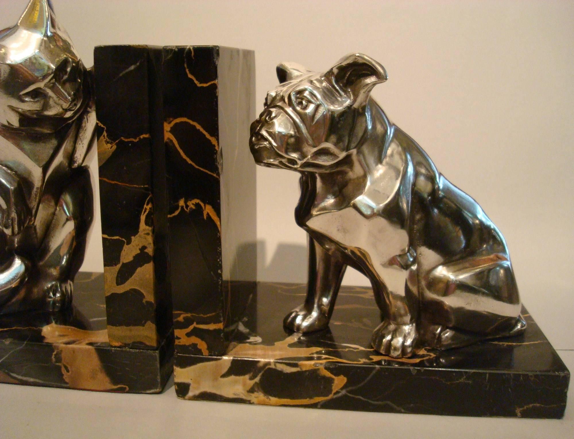 Description: Art Deco metal bookends with cat and bulldog.
Artist / Maker: Irénée Rochard.
Signature / Marks: Rochard.
Style: Art Deco.
Date: 1930.
Material: Metal with silver patina. Portoro marble base.
Origin: France.
Size of one:
H 15.5